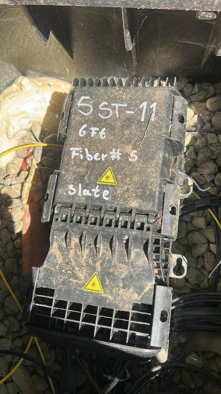 Public-safe portfolio image of fiber optic cable and service handoff work before final signal testing
