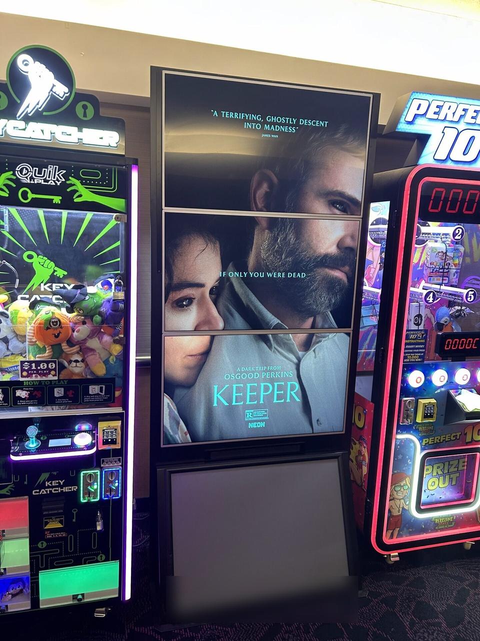 Multi-TV theater poster display assembled from multiple screens during an Alrty onsite service visit