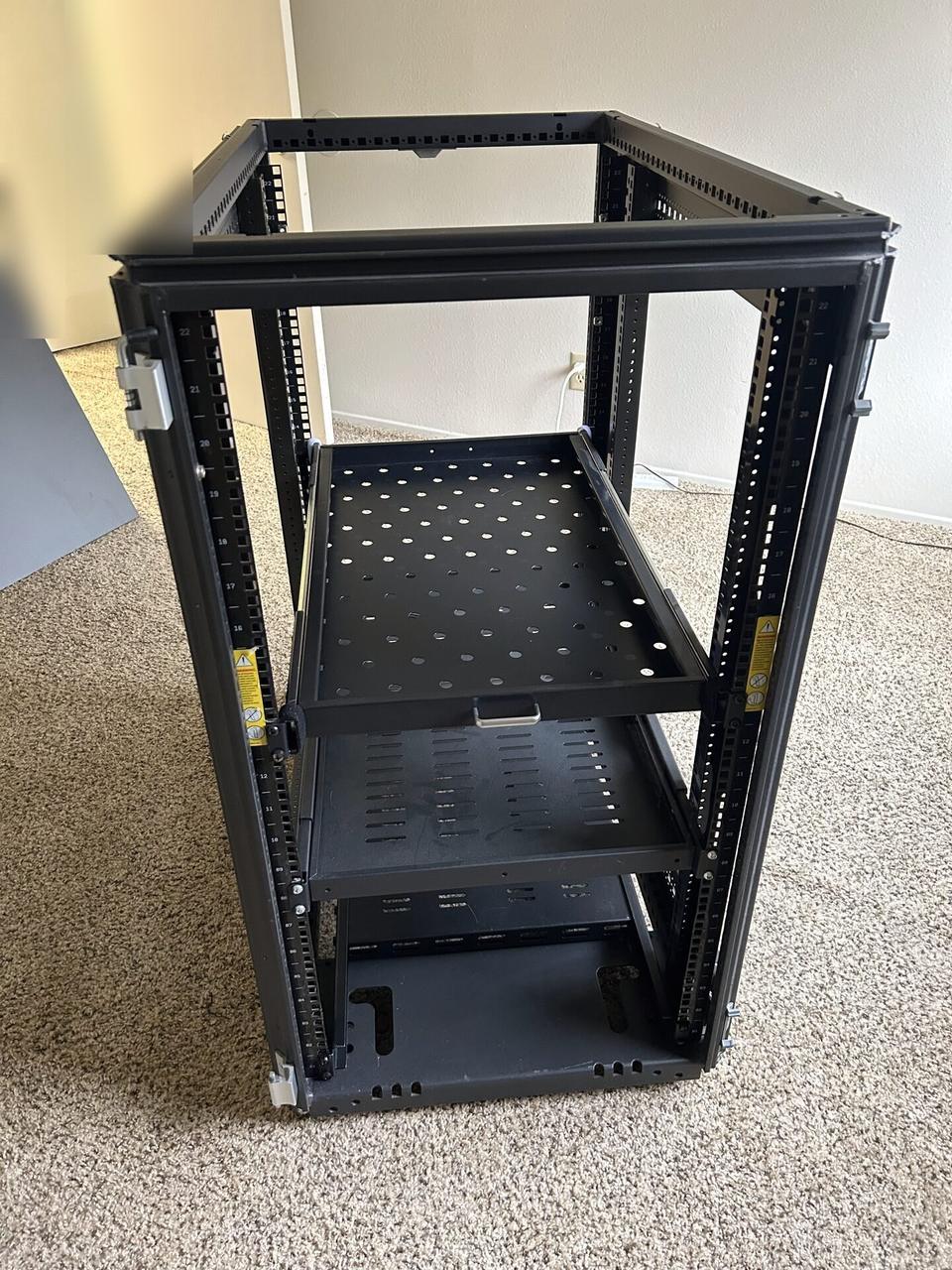 Public-safe portfolio image of empty equipment cabinet or small network rack