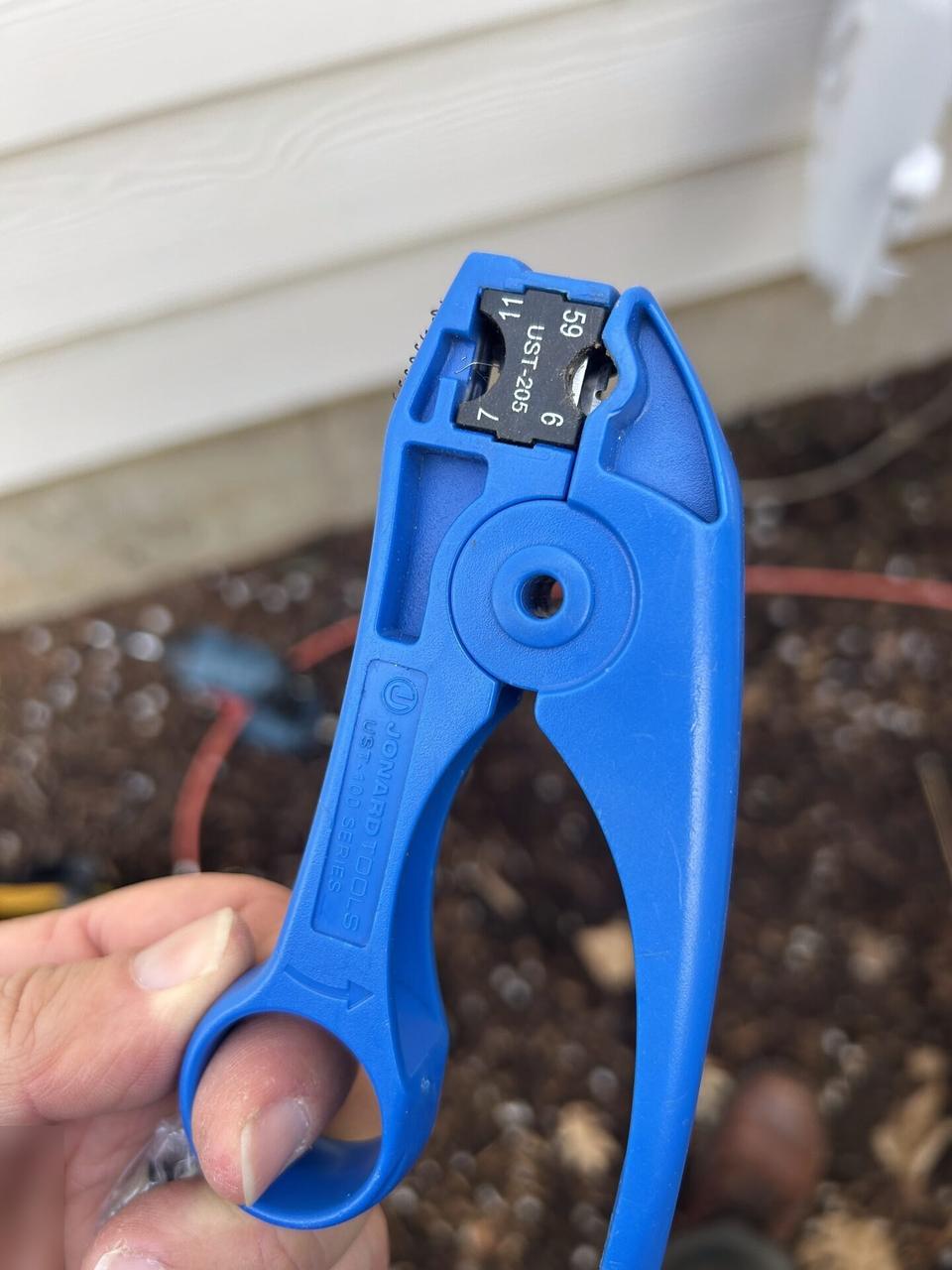 Technician tools staged for onsite service with private labels omitted documented for a smart technology service call