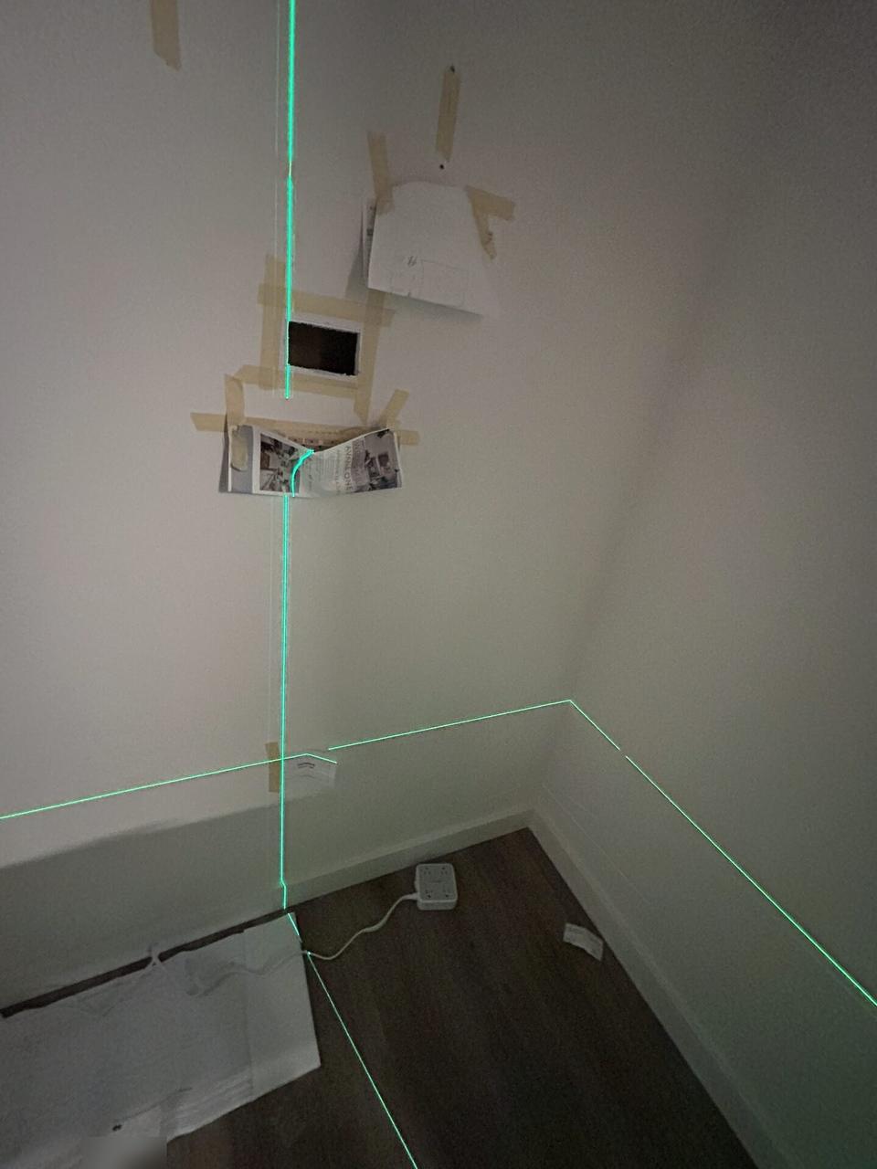 Public-safe portfolio image of TV mounting and display setup work with cable routing visible