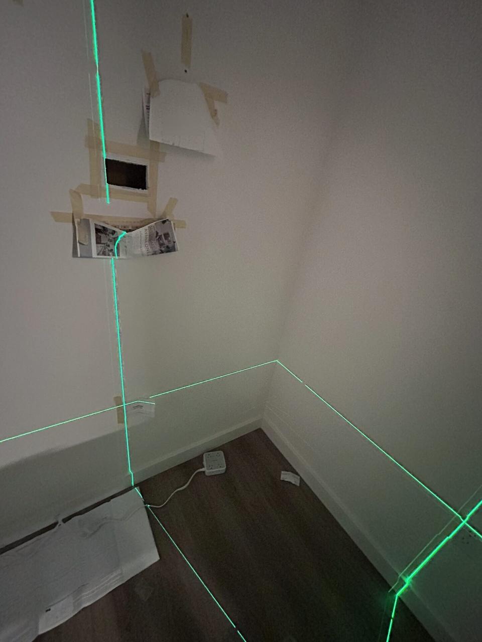 Onsite service photo showing TV mounting and display setup work before final viewing checks