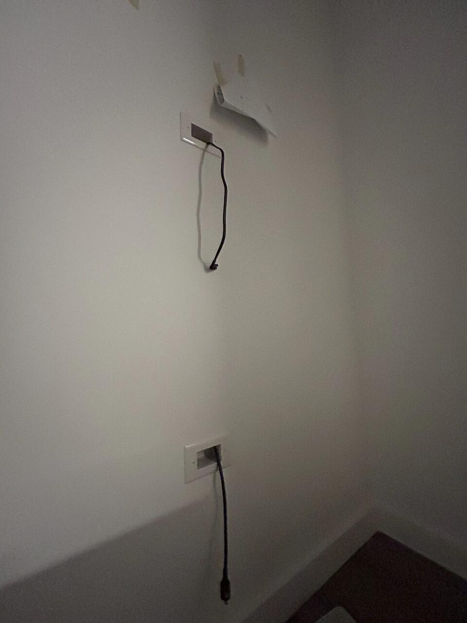 Public-safe portfolio image of home theater cabling and display service detail during TV service preparation