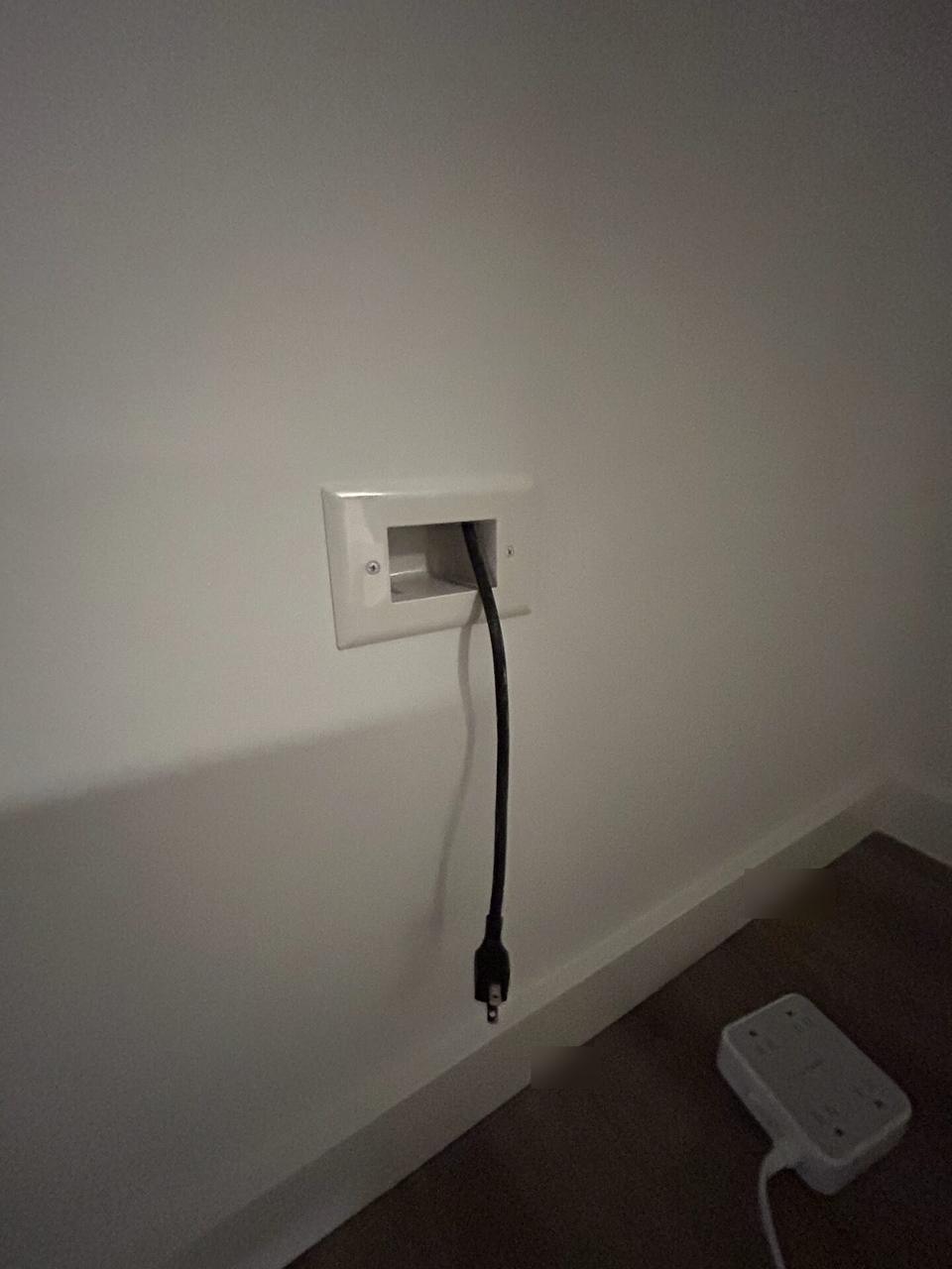 Onsite service photo showing display bracket or mounting preparation onsite during TV service preparation