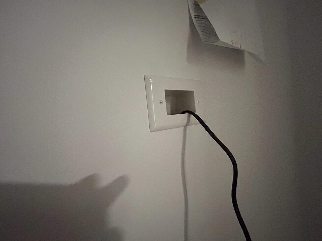 Finished low-voltage wall plate with cable for TV wire concealment