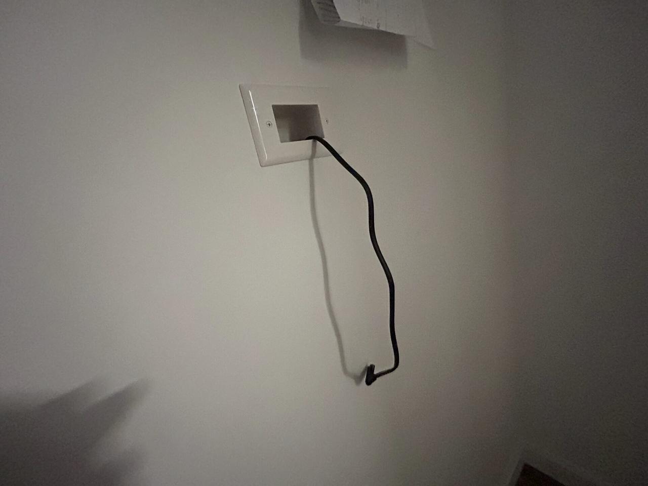 Alrty field photo with home theater cabling and display service detail near the mounting location