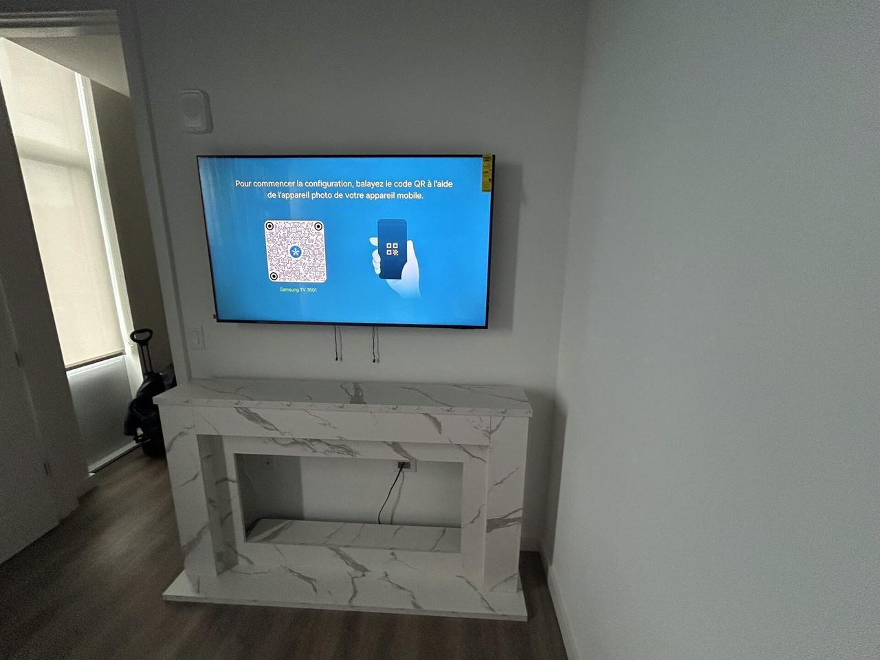 Finished mounted television area after hidden wire planning and closeout