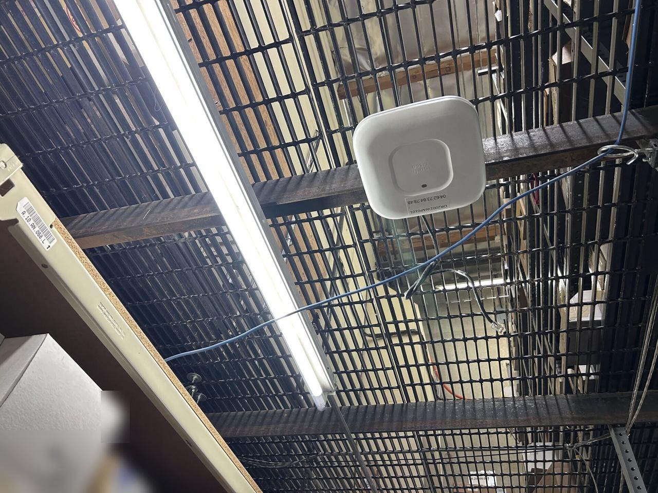 Enterprise retail wireless access point refresh with service ports visible documented for a smart technology service call