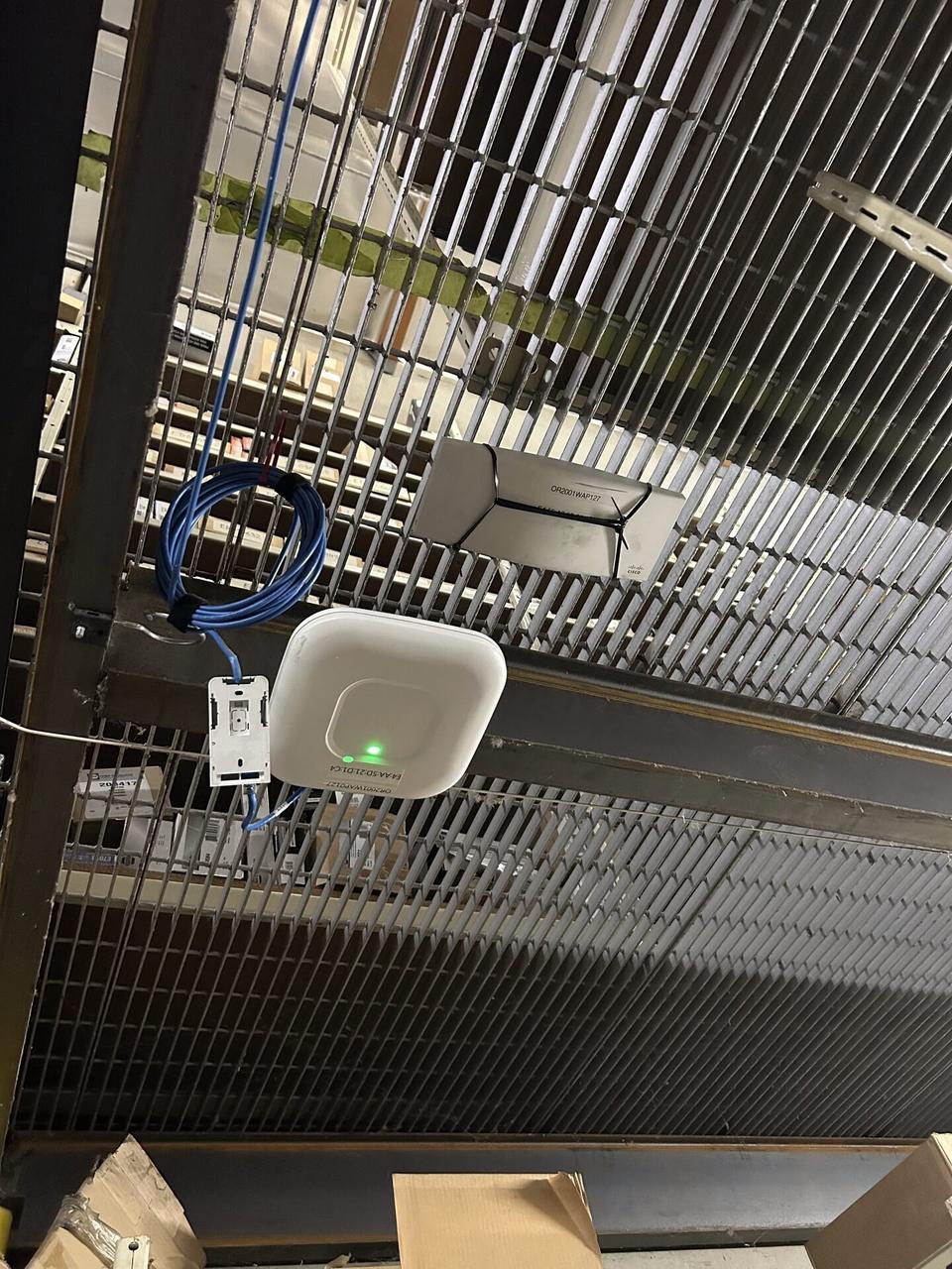 Enterprise retail wireless access point refresh during connectivity validation documented for a smart technology service call