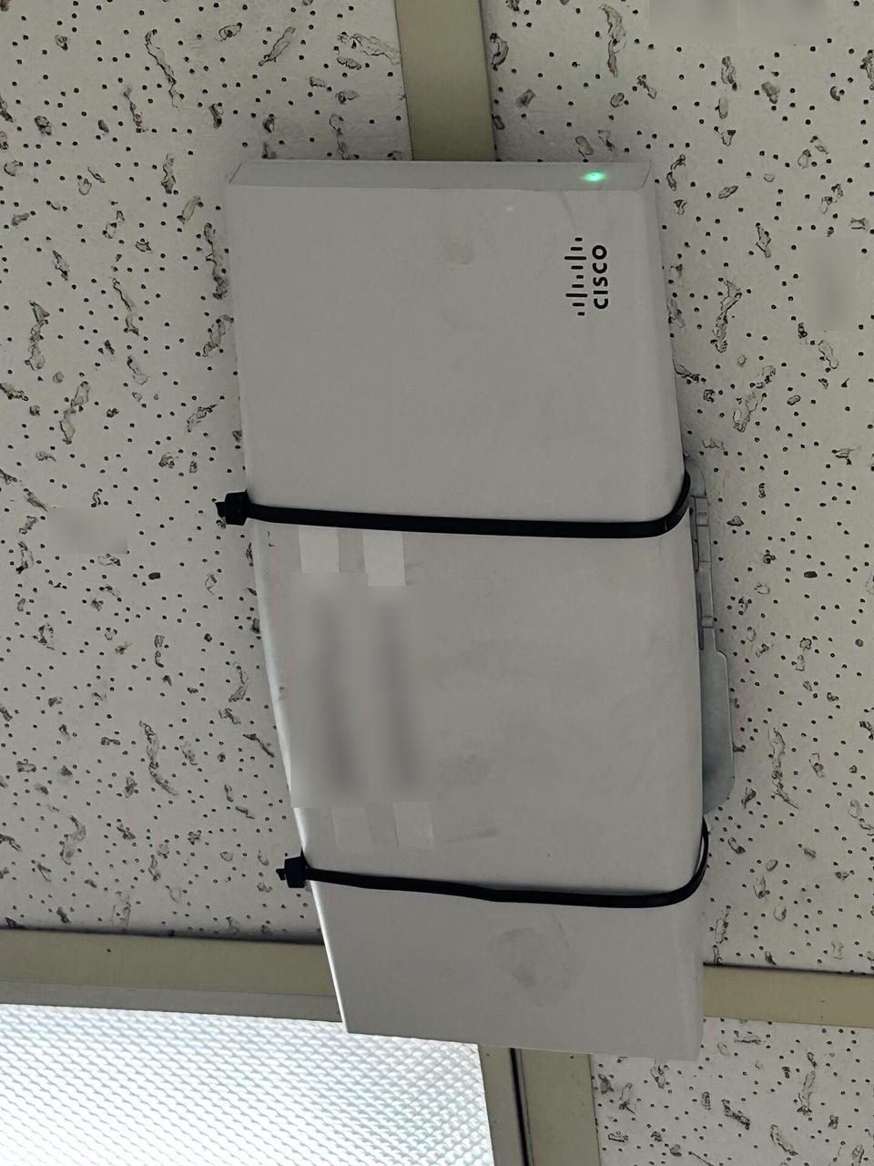 Onsite service photo showing enterprise retail wireless access point refresh for onsite Wi-Fi support