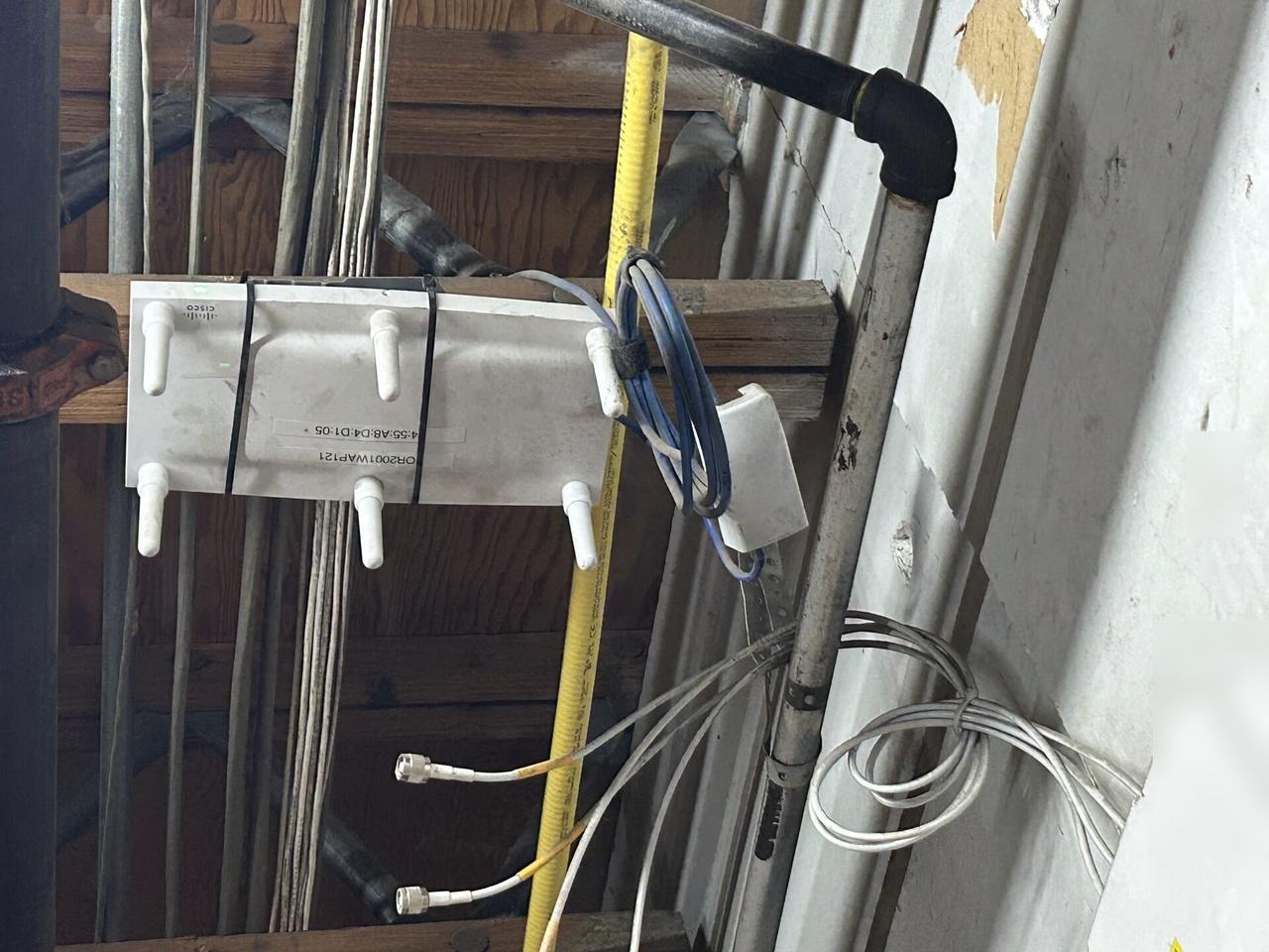 Onsite service photo showing enterprise retail wireless access point refresh for onsite Wi-Fi support