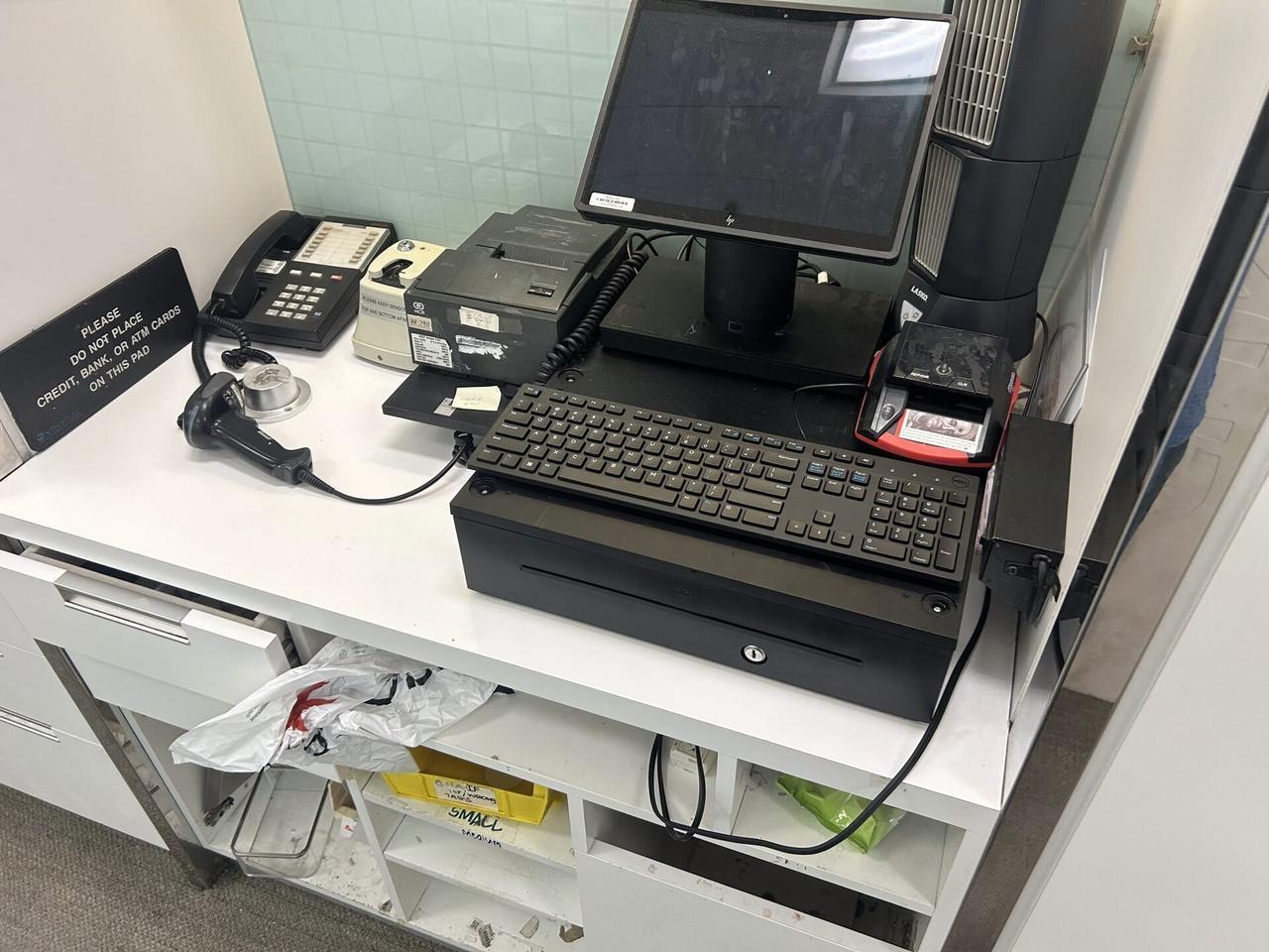 Onsite service photo showing credit-card payment terminal and POS hardware