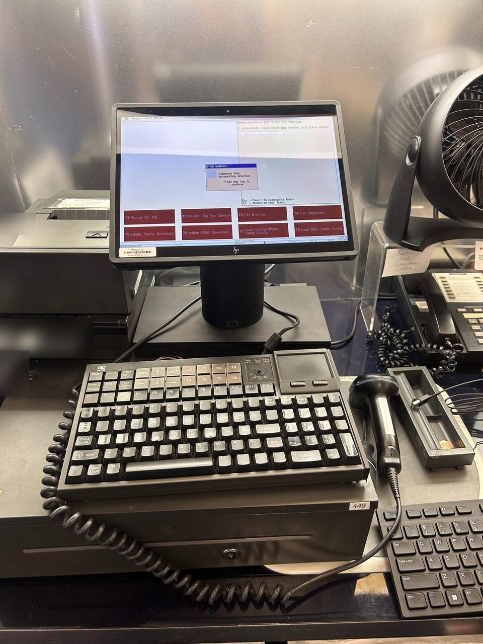 Alrty field photo with credit-card payment terminal and POS hardware