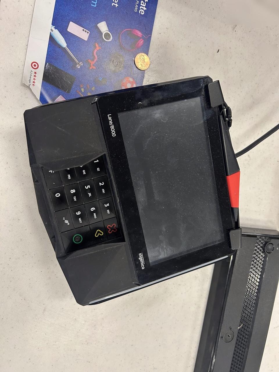 Public-safe portfolio image of checkout station POS hardware at a checkout lane