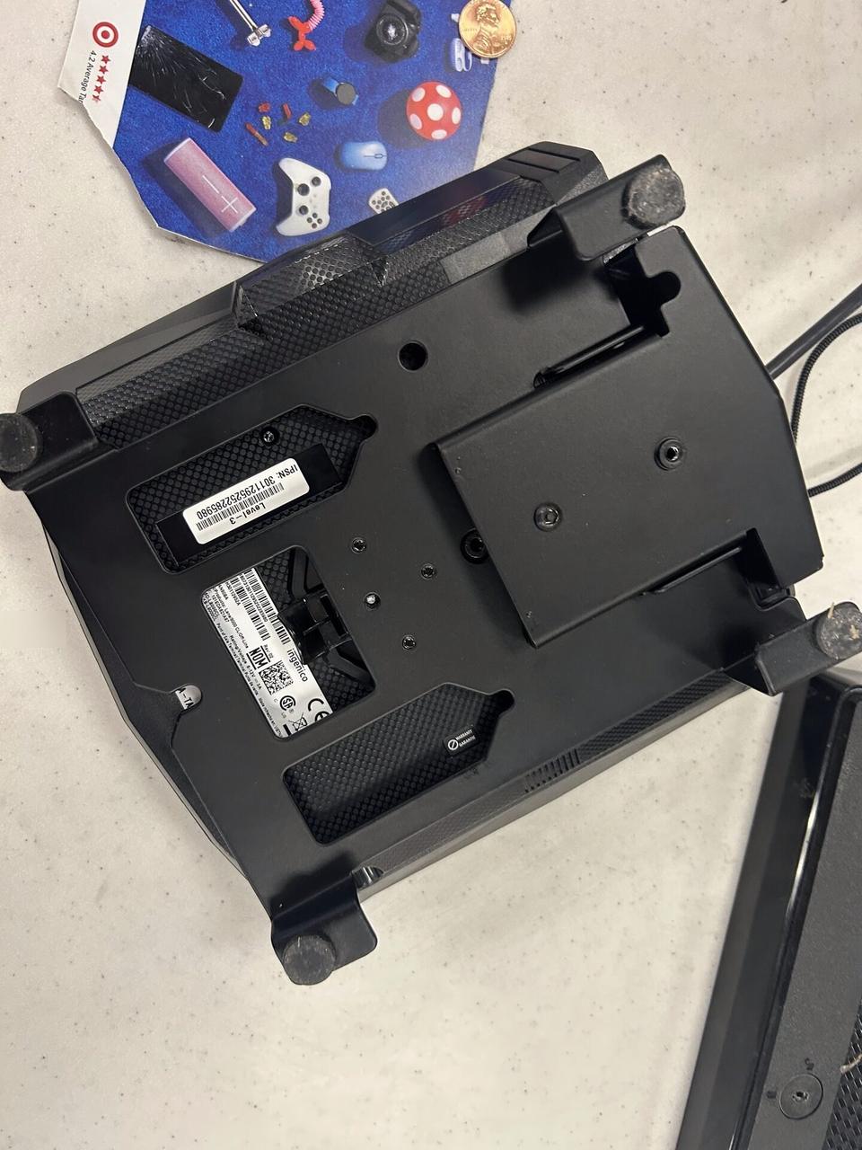 Public-safe portfolio image of checkout station POS hardware with cable routing visible