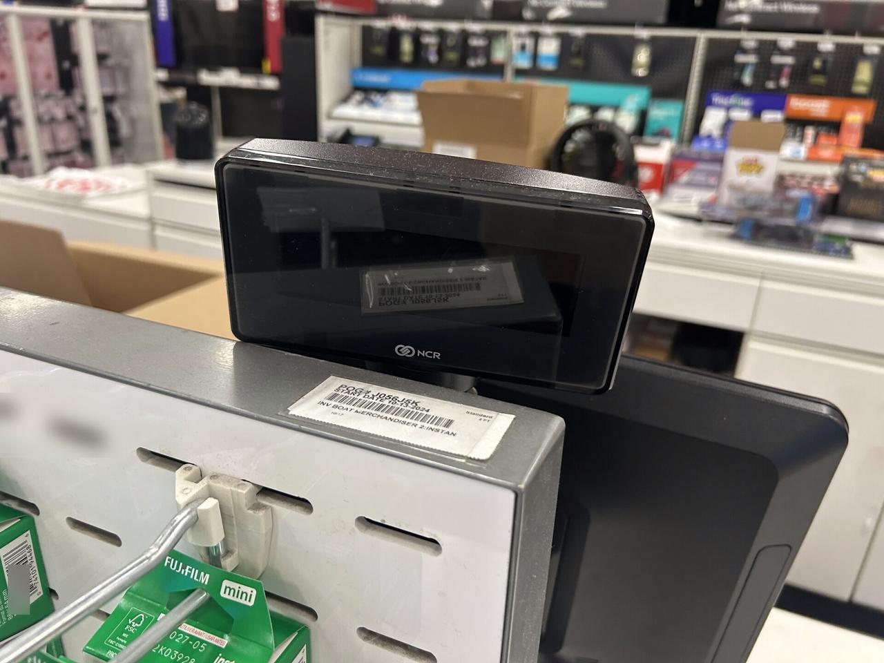 Onsite service photo showing checkout station POS hardware before final lane testing