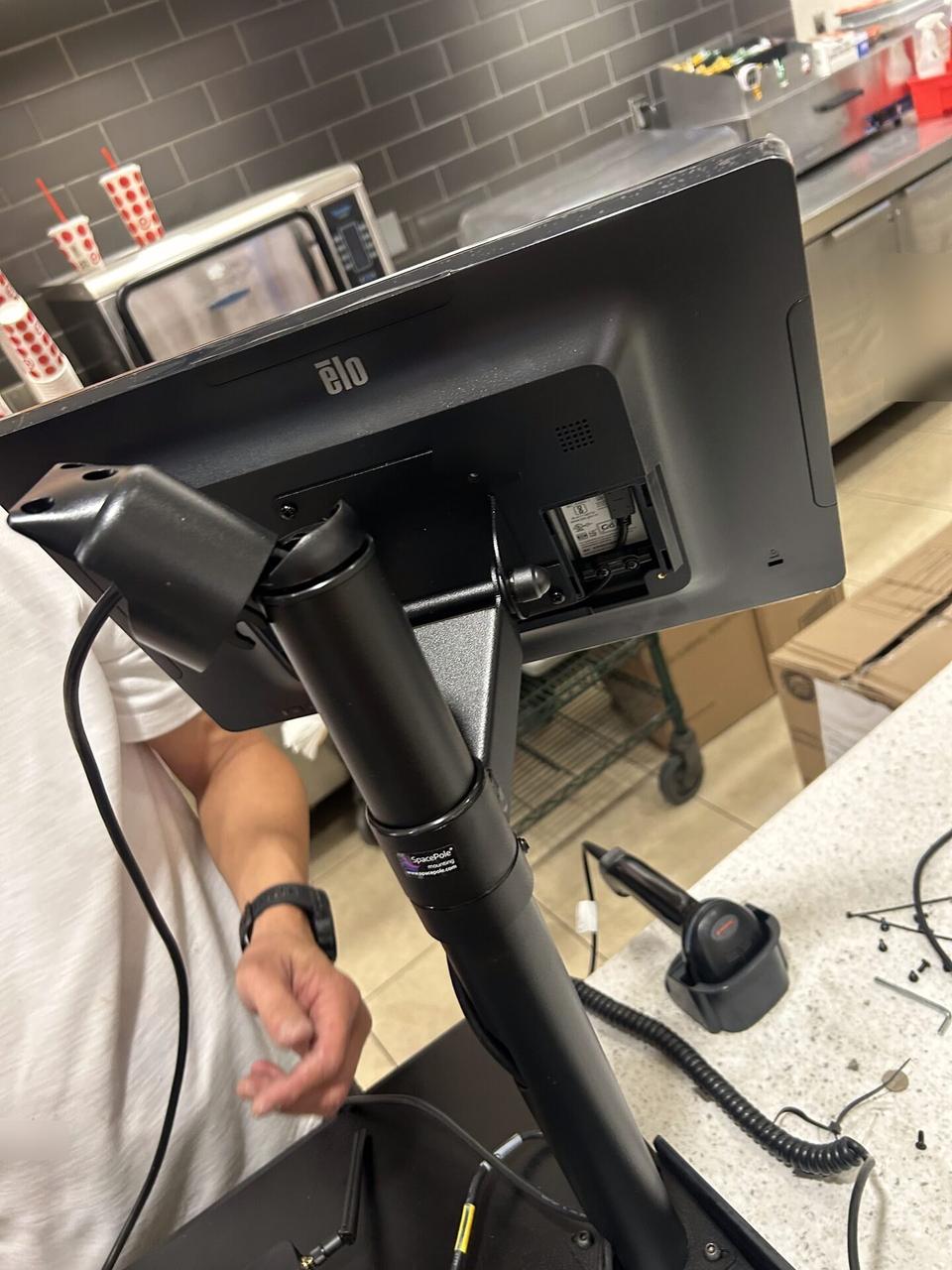 Onsite service photo showing checkout station POS hardware for payment hardware service
