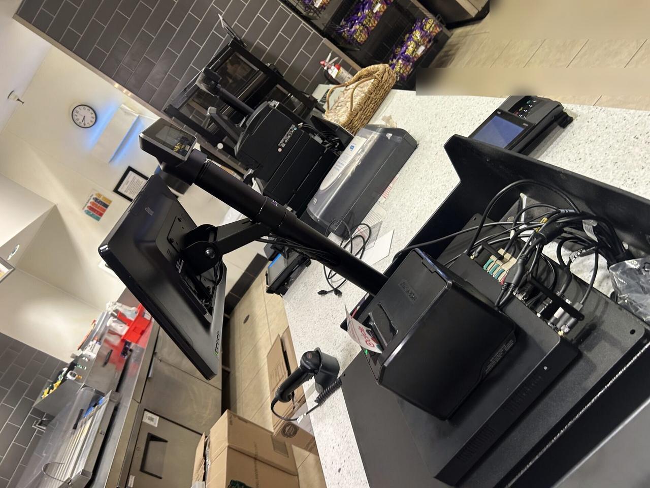 Onsite service photo showing context-corrected POS and retail technology field-service photo during retail support
