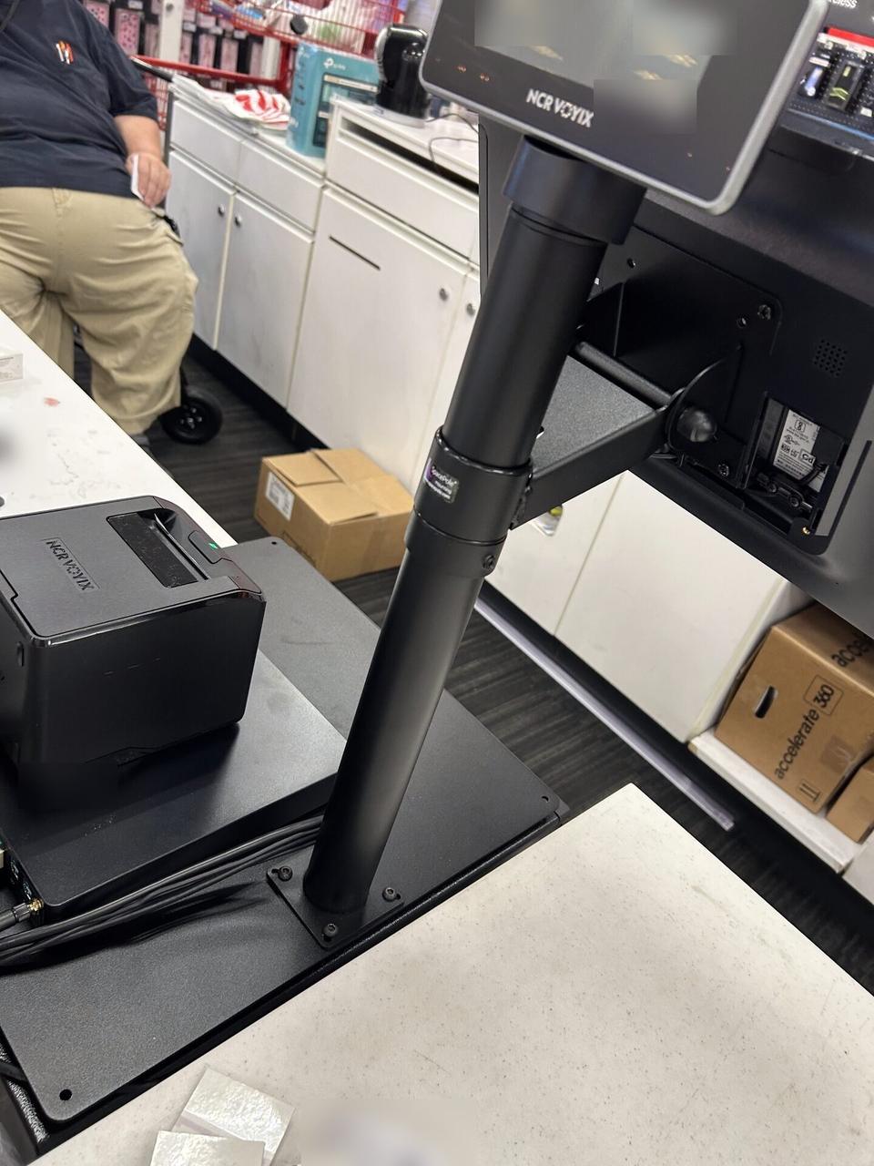 Onsite service photo showing checkout station POS hardware during register setup