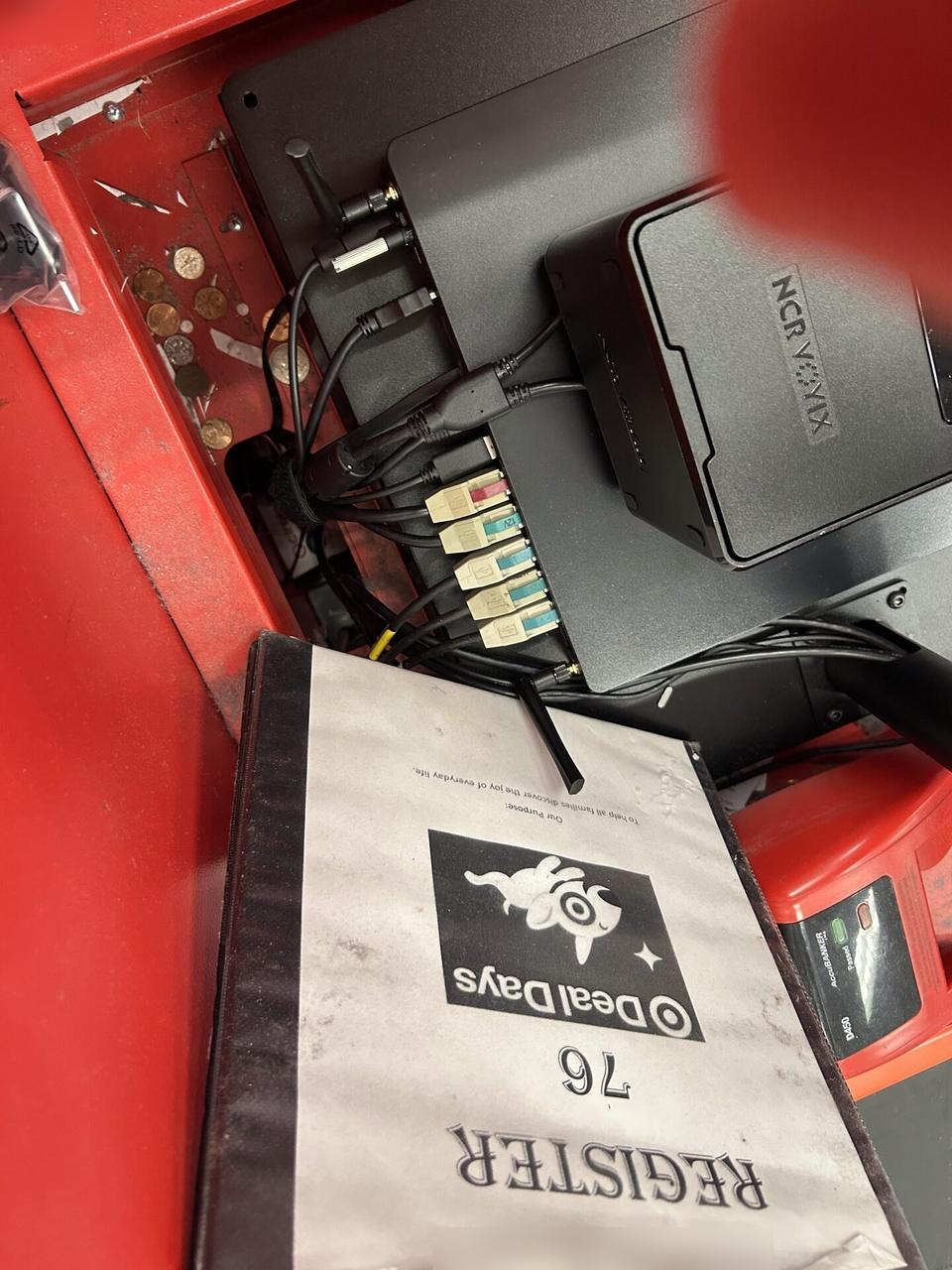 Public-safe portfolio image of checkout station POS hardware with cable routing visible