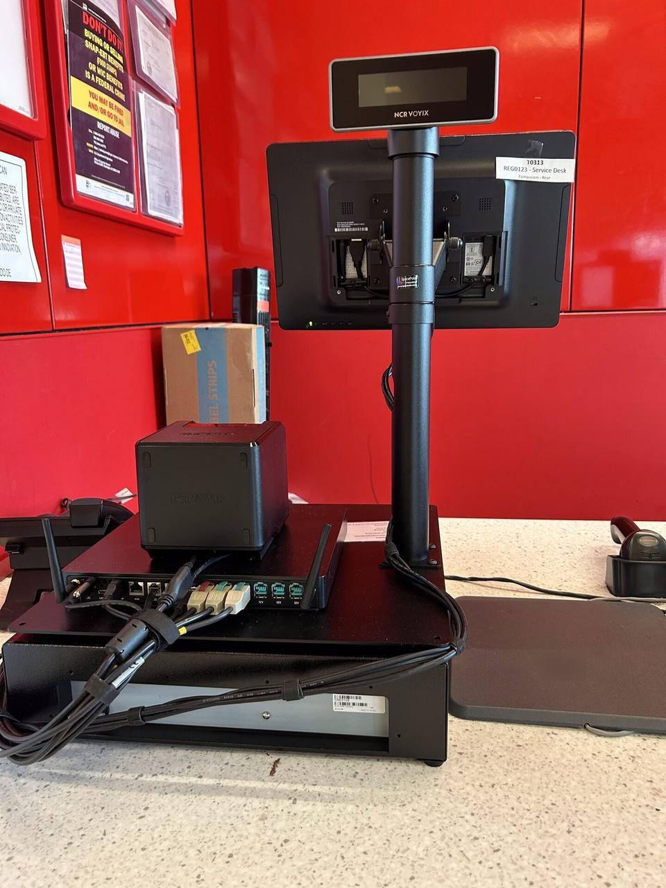 Alrty portfolio view of checkout station POS hardware with cable routing visible
