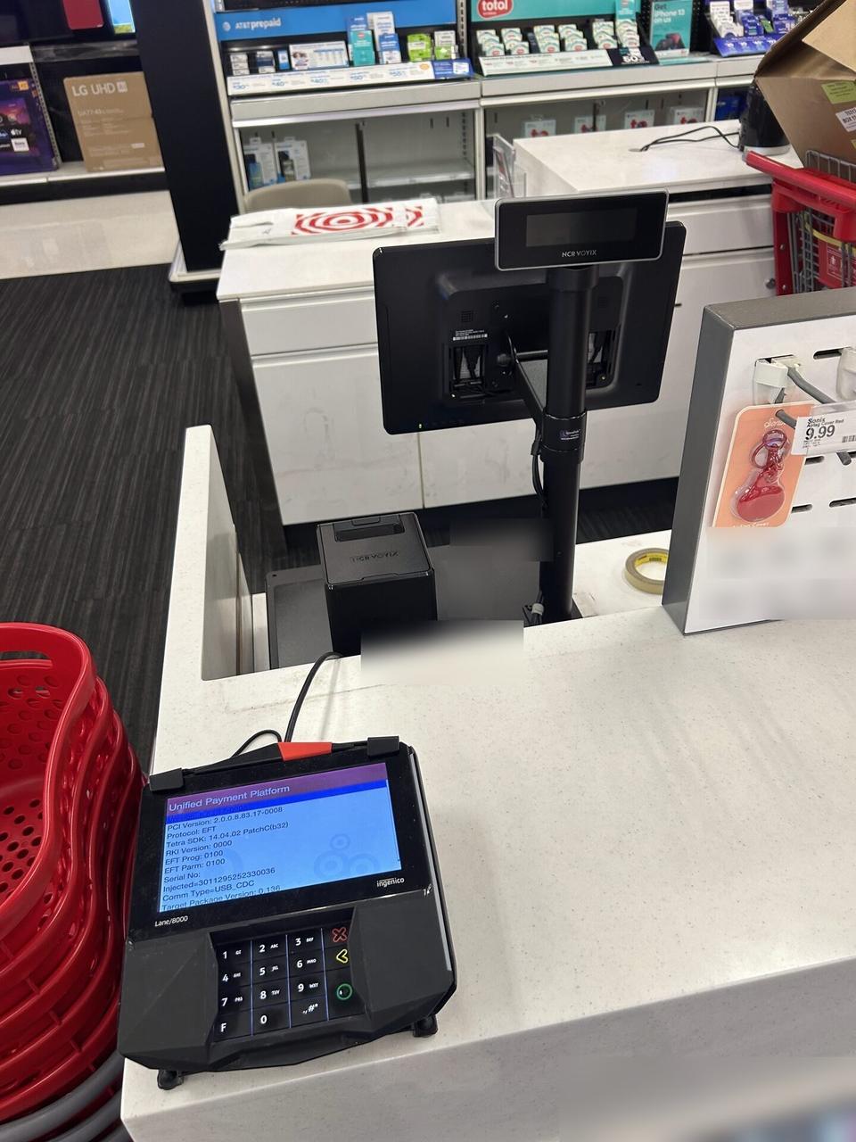 Onsite service photo showing checkout station POS hardware before final lane testing