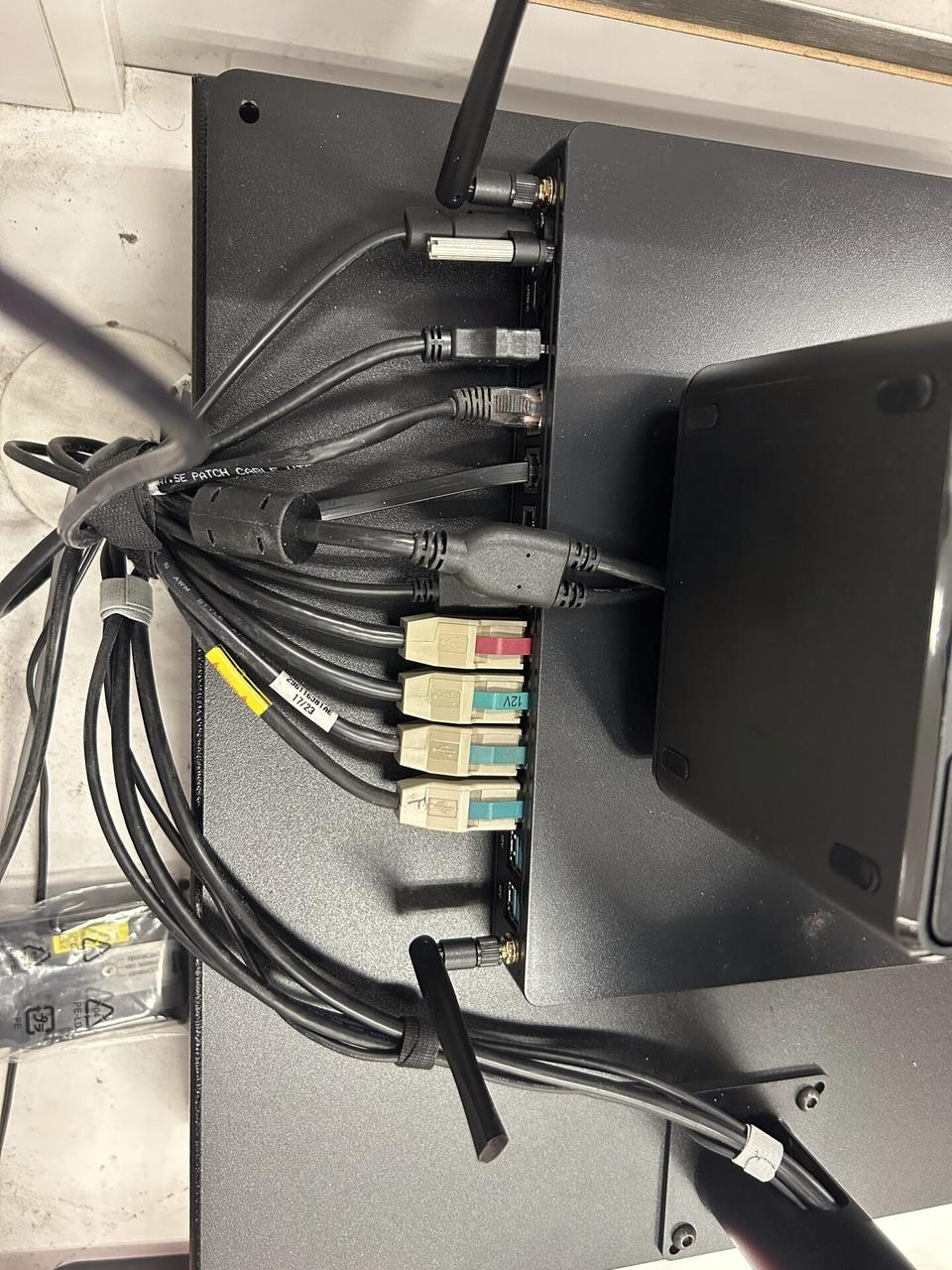 Service documentation showing checkout station POS hardware with cable routing visible