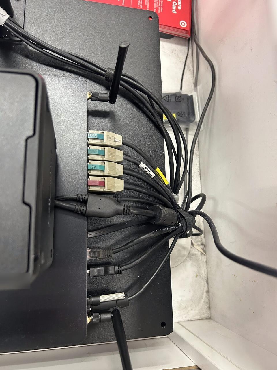 Onsite service photo showing checkout station POS hardware at the checkout counter