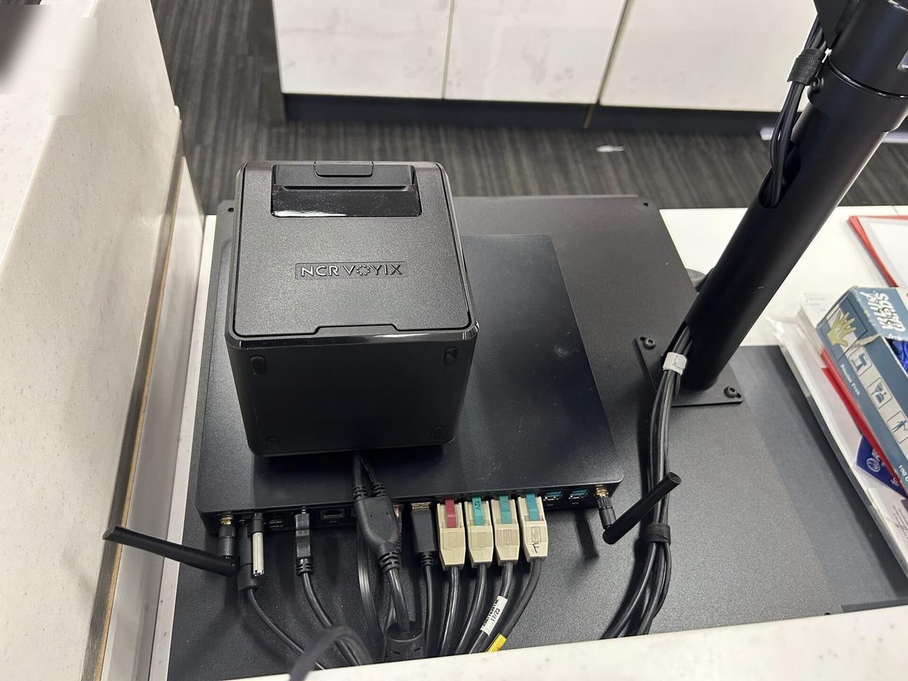 Service documentation showing retail checkout work area with POS terminal hardware