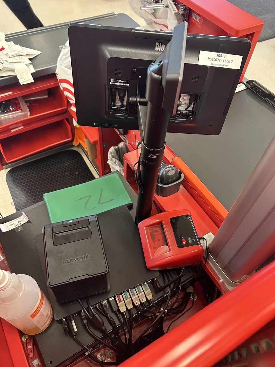 Onsite service photo showing retail checkout work area with POS terminal hardware