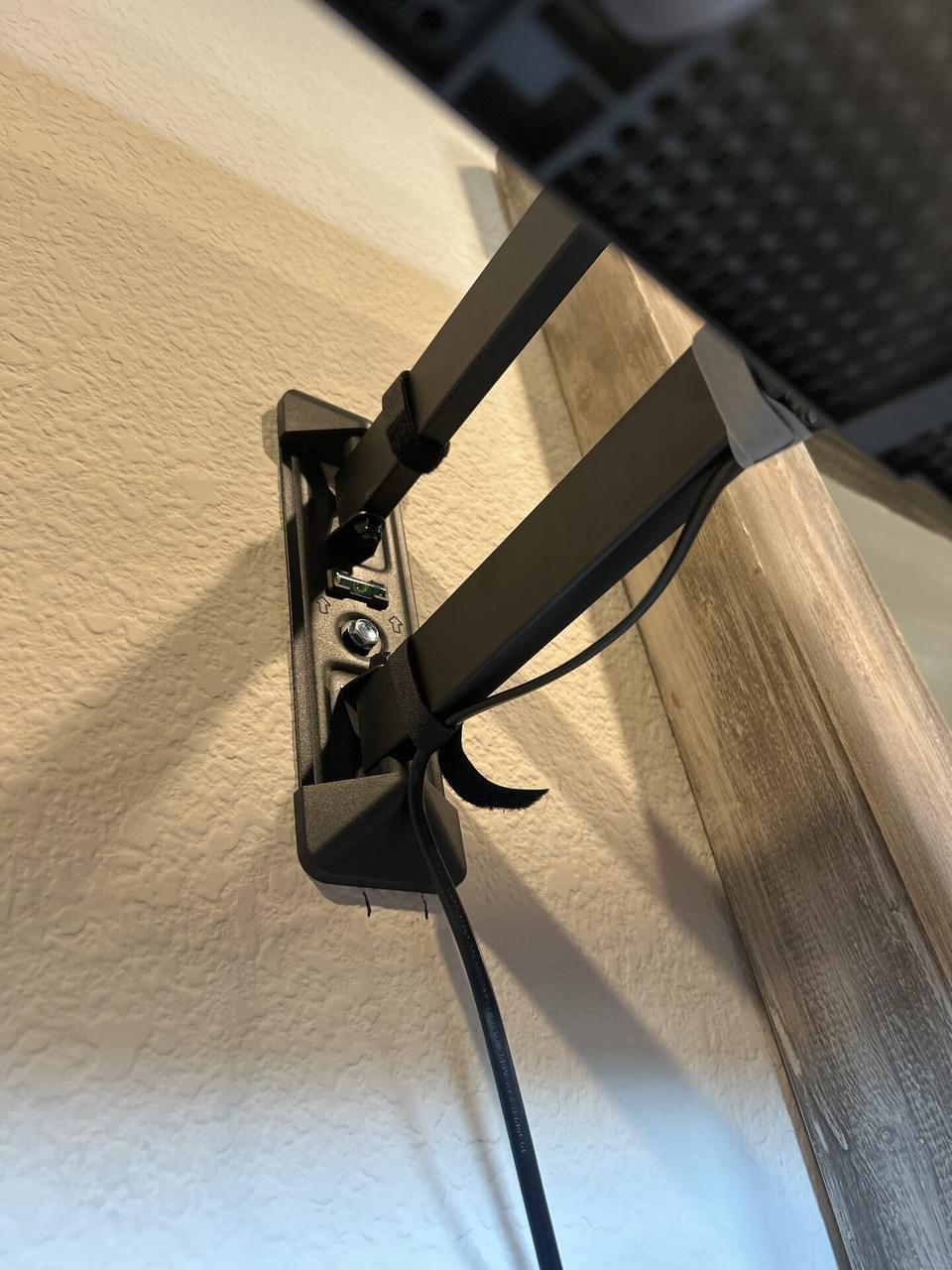 Alrty field photo with display bracket or mounting preparation onsite during TV service preparation