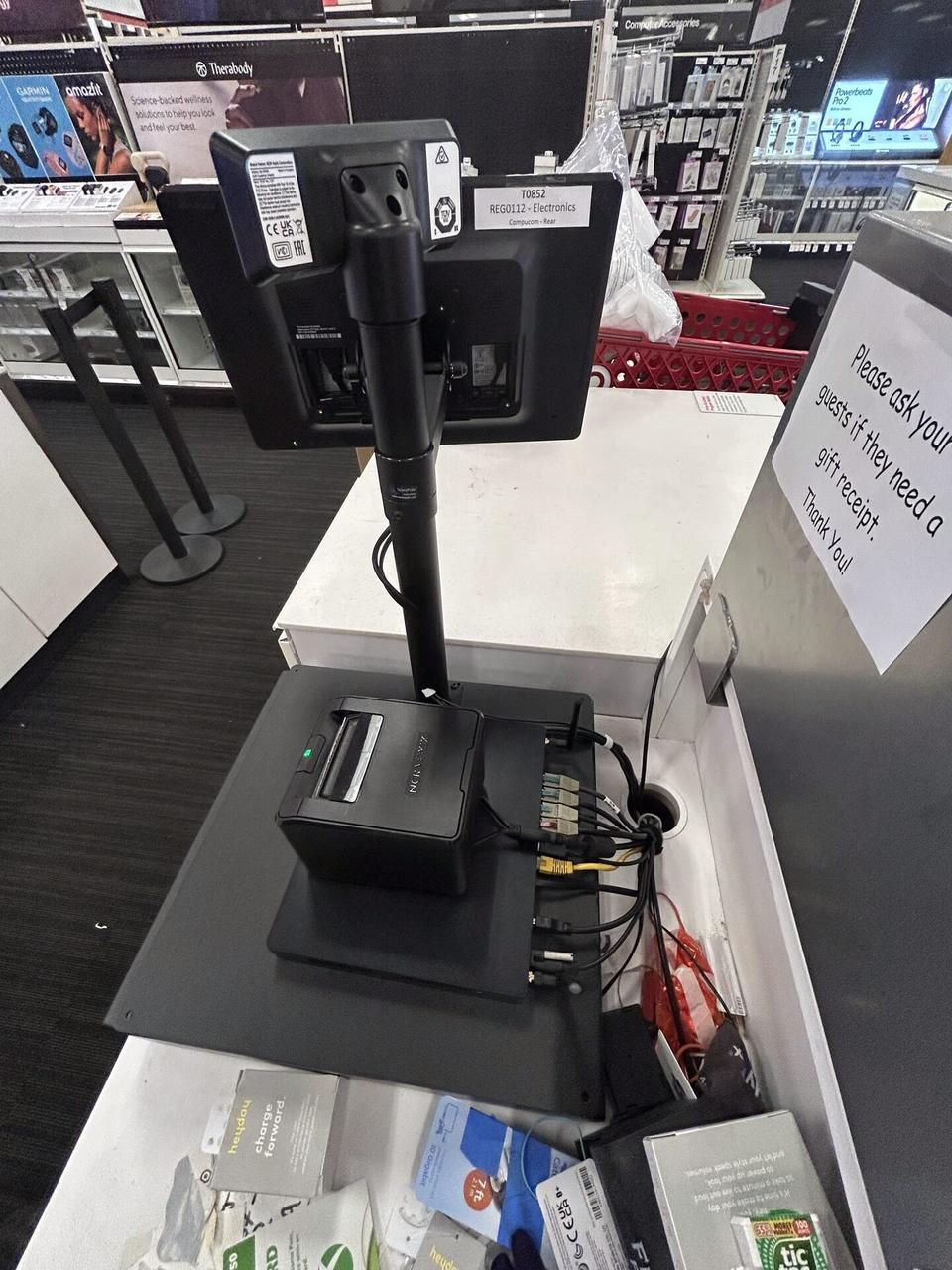 POS workstation hardware at a retail service lane at the checkout counter during an Alrty onsite service visit