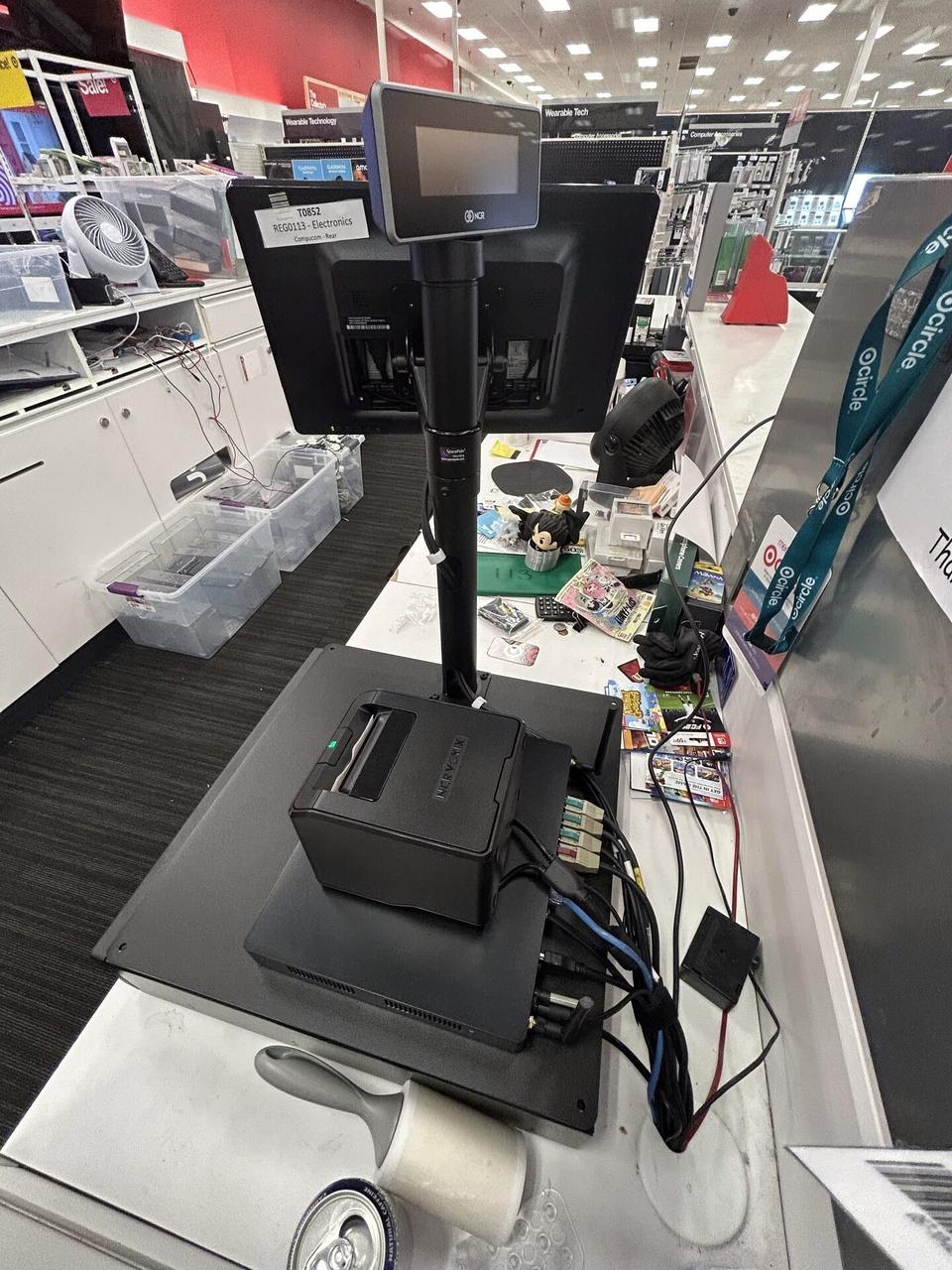 Service documentation showing retail checkout work area with POS terminal hardware