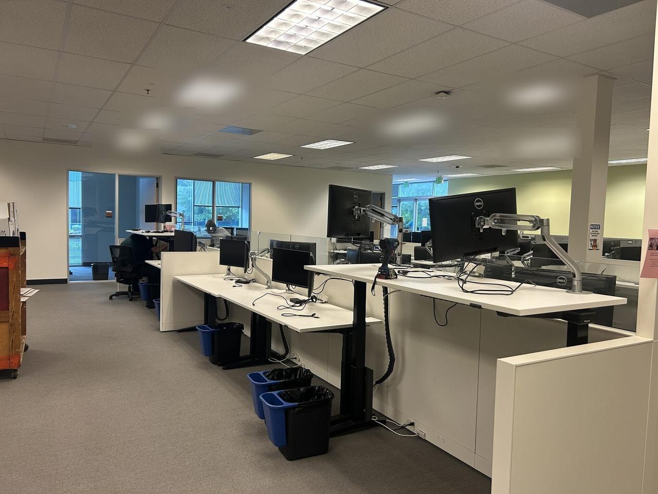 Office workstation setup with monitors for office technology support documented for a smart technology service call