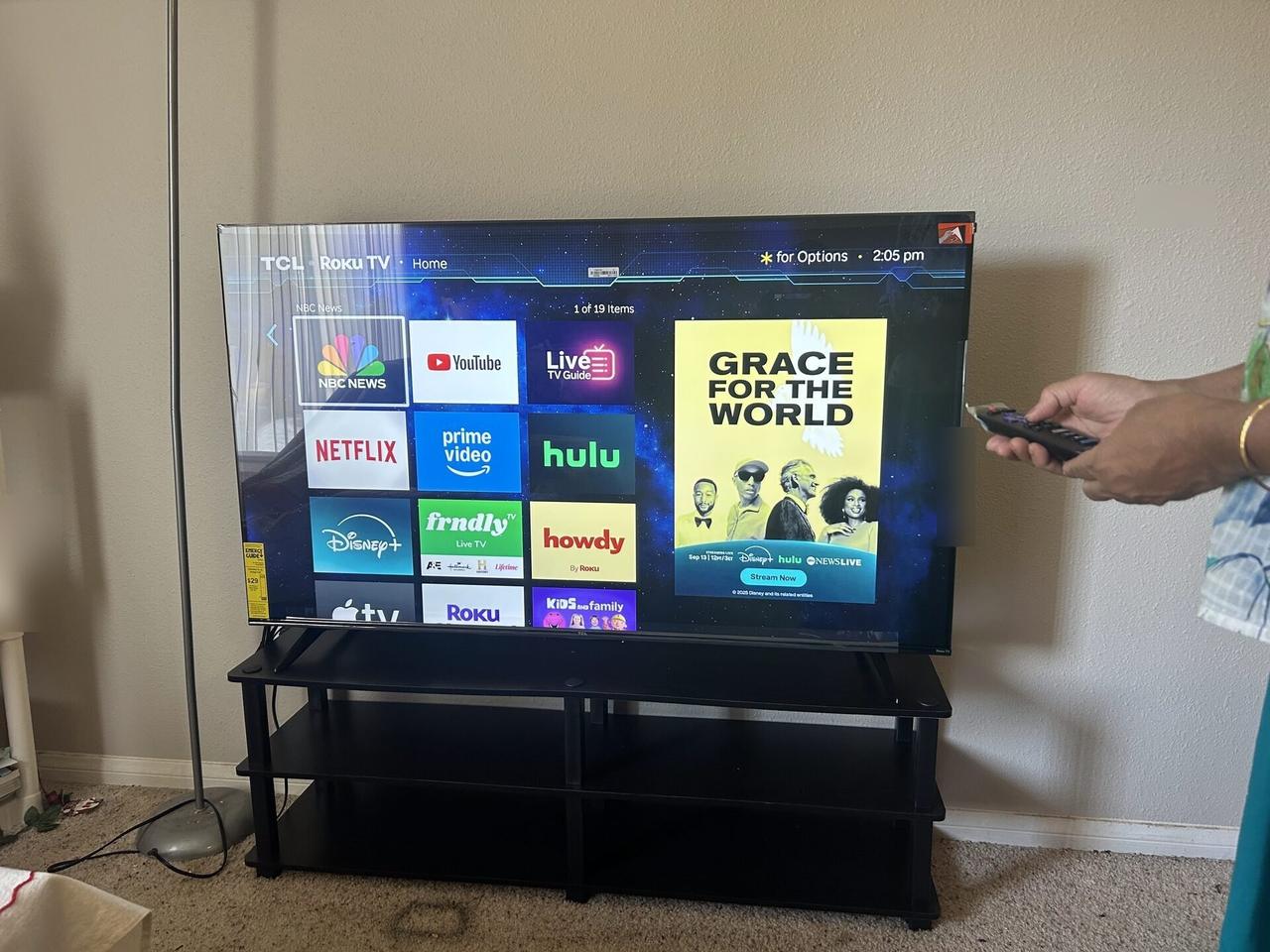 Alrty portfolio view of streaming device and television setup context with cable routing visible