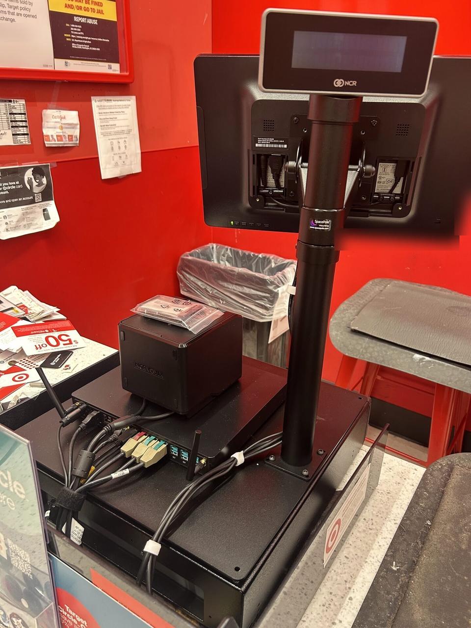 Public-safe portfolio image of retail checkout work area with POS terminal hardware