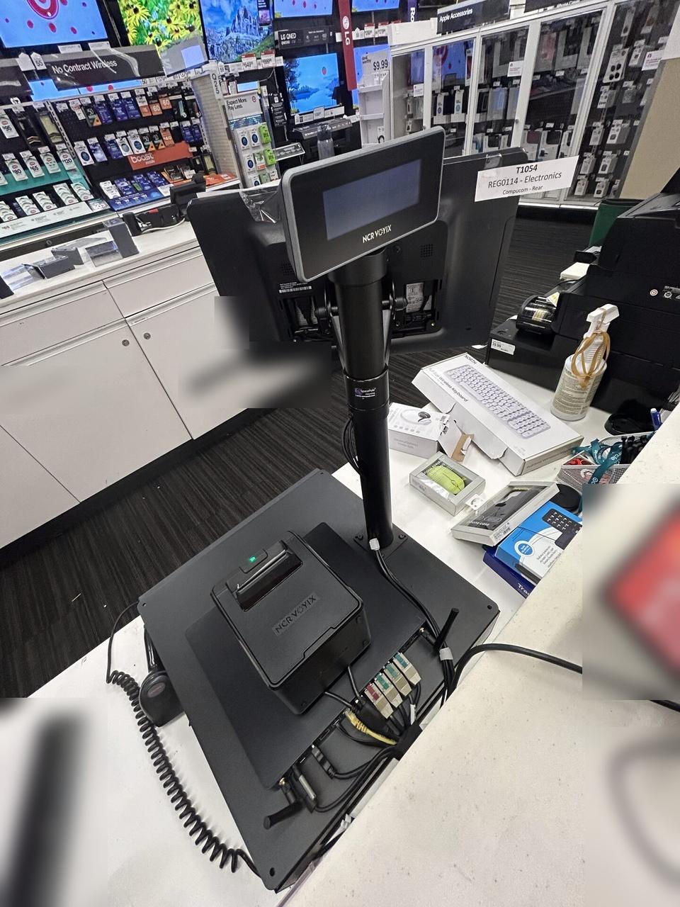 Alrty field photo with retail checkout work area with POS terminal hardware