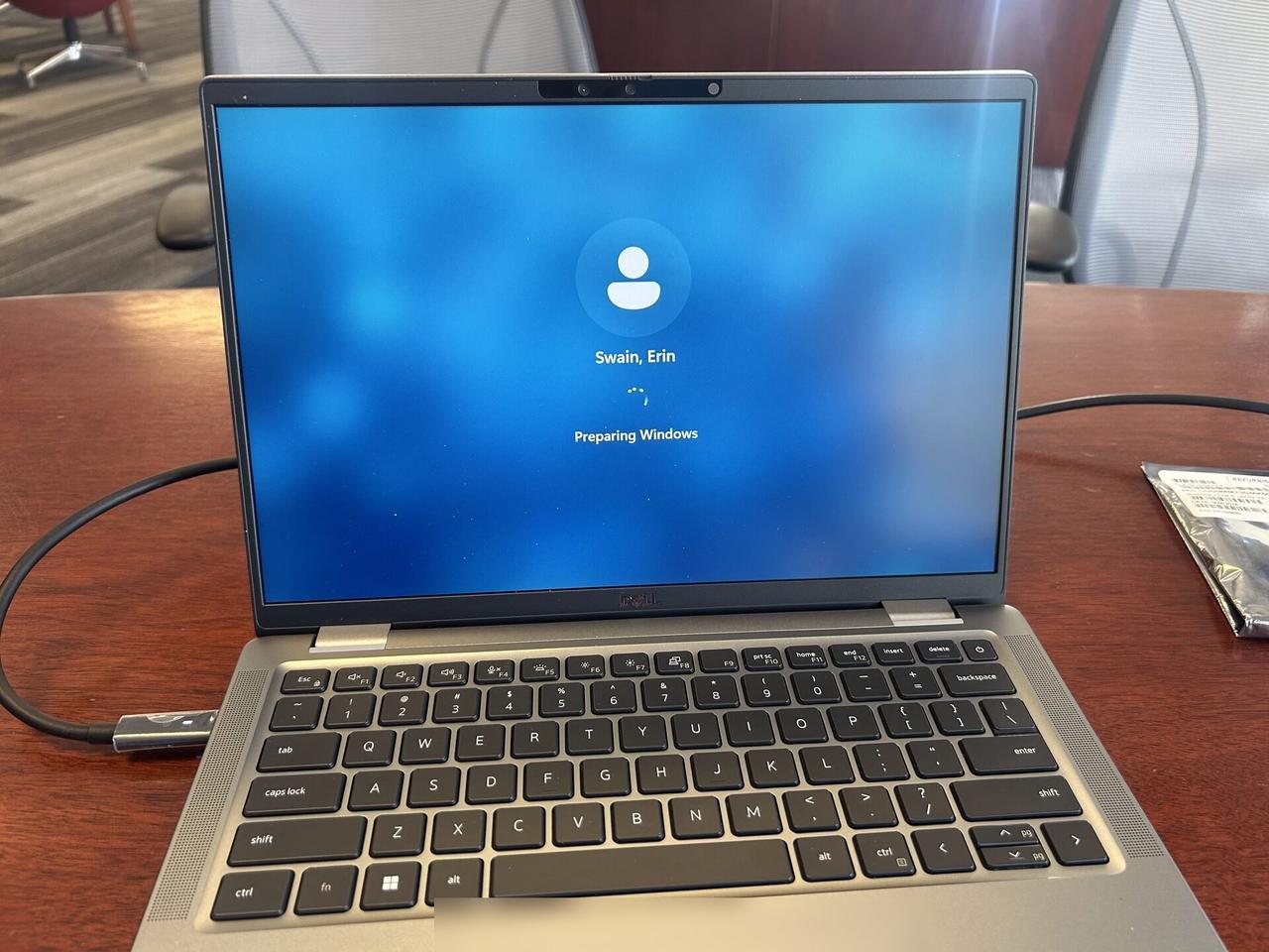Public-safe portfolio image of workstation screen and connected equipment check during monitor setup