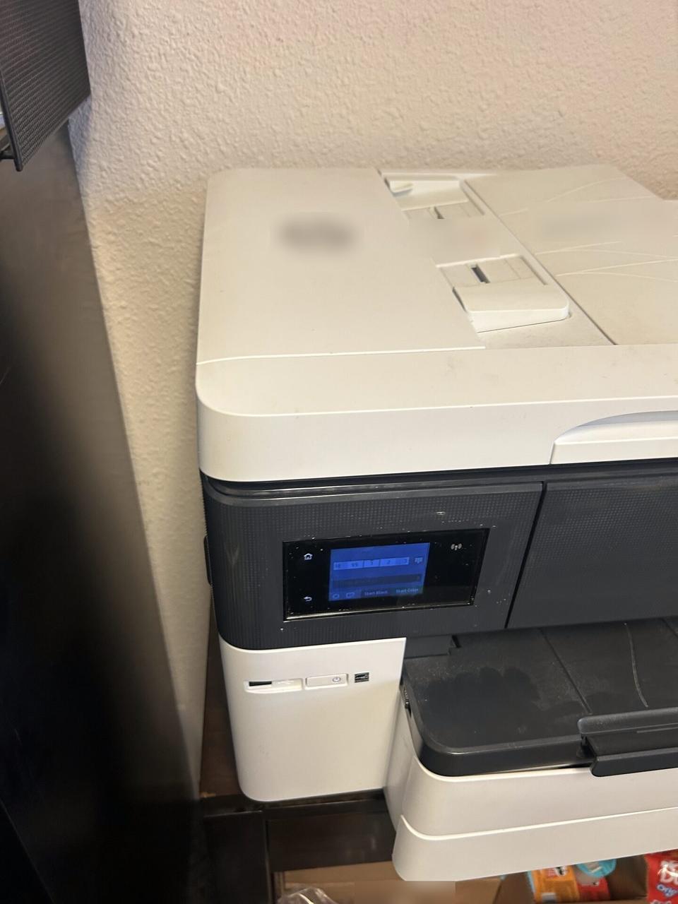 Service documentation showing printer or peripheral setup during onsite service for office hardware support