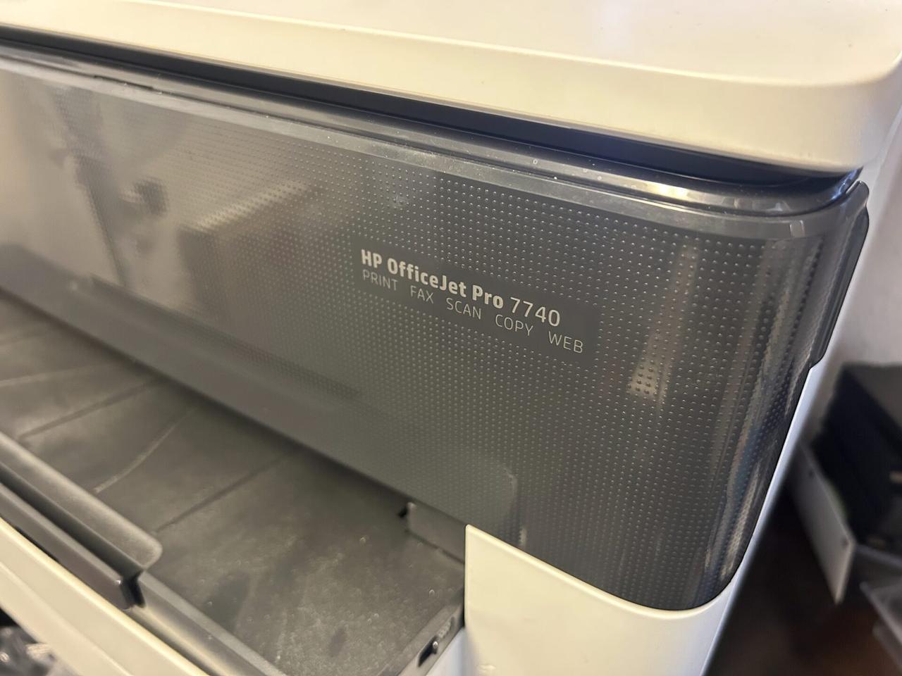 Alrty field photo with printer or peripheral setup during onsite service with connection context visible