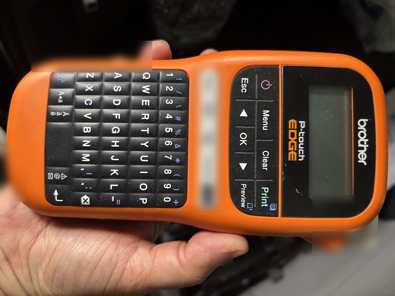 Onsite service photo showing label printer used for cable and device labeling