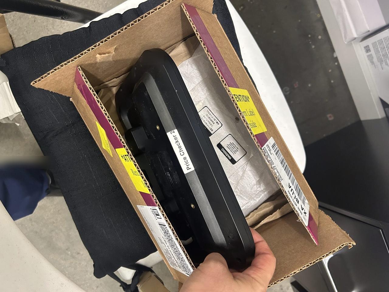 Public-safe portfolio image of payment terminal and POS equipment handoff at a checkout lane