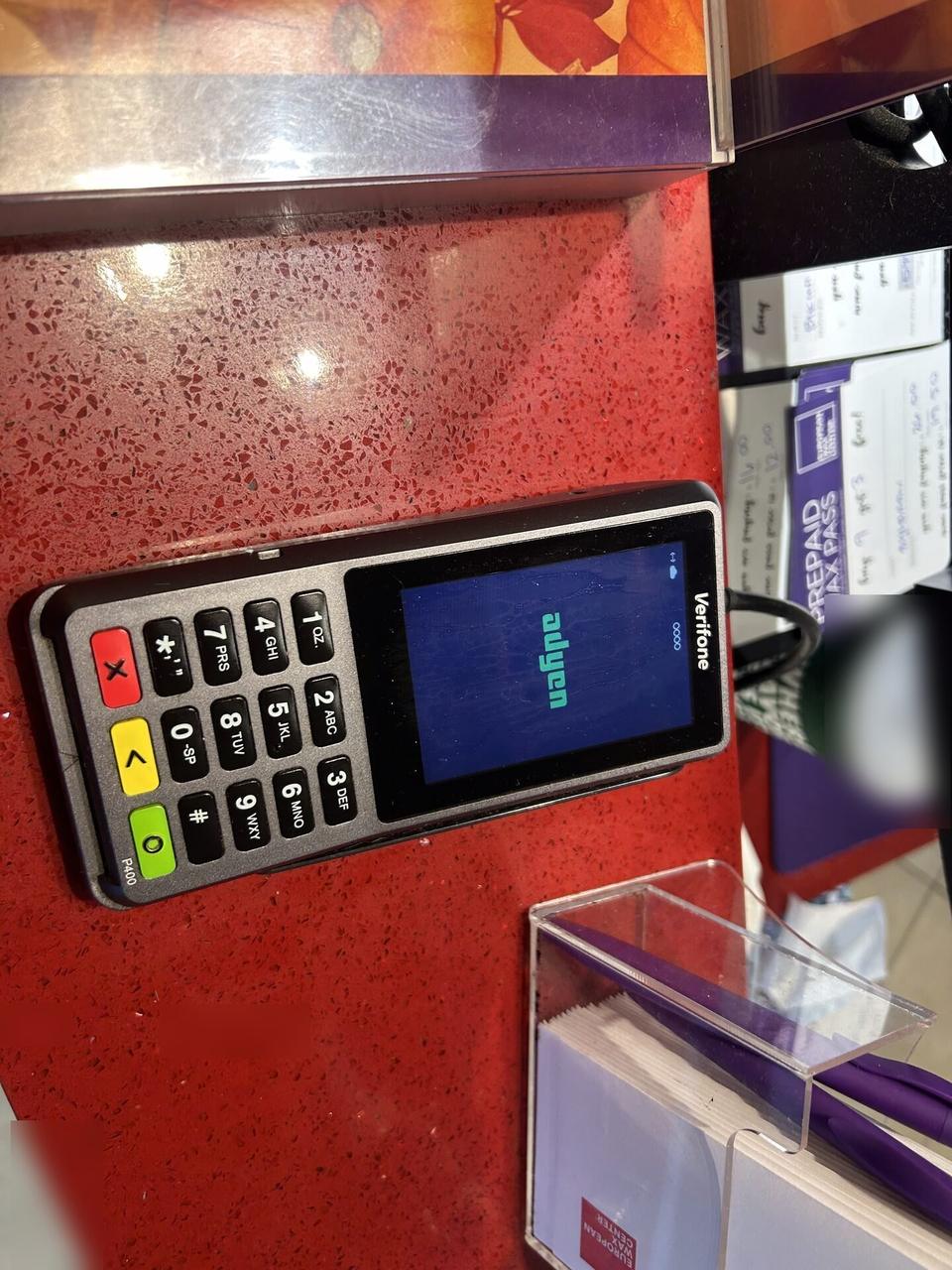 Onsite service photo showing Verifone credit card reader for Visa and Mastercard payment acceptance