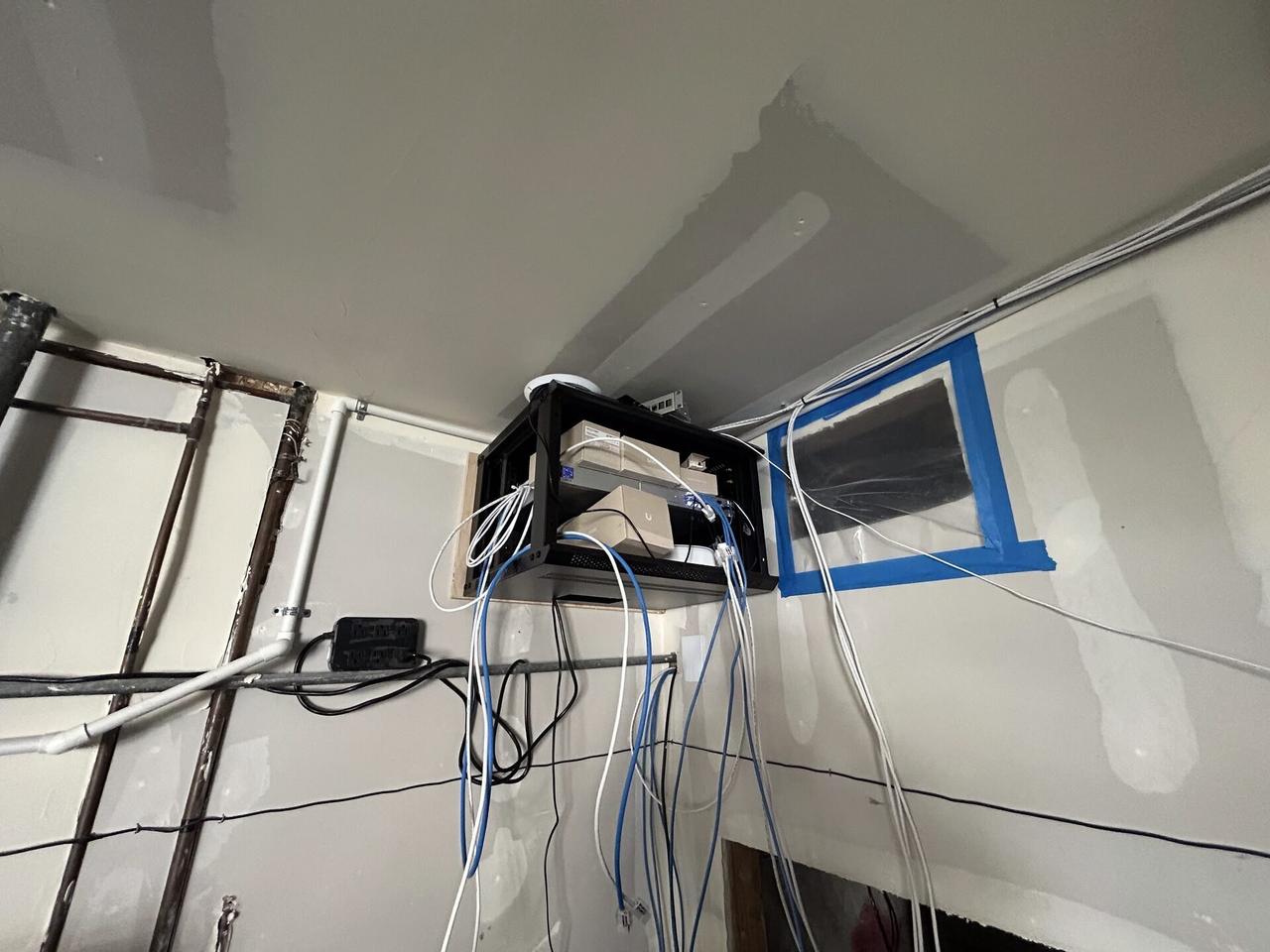 Onsite service photo showing security camera and low-voltage wiring service during CCTV equipment service