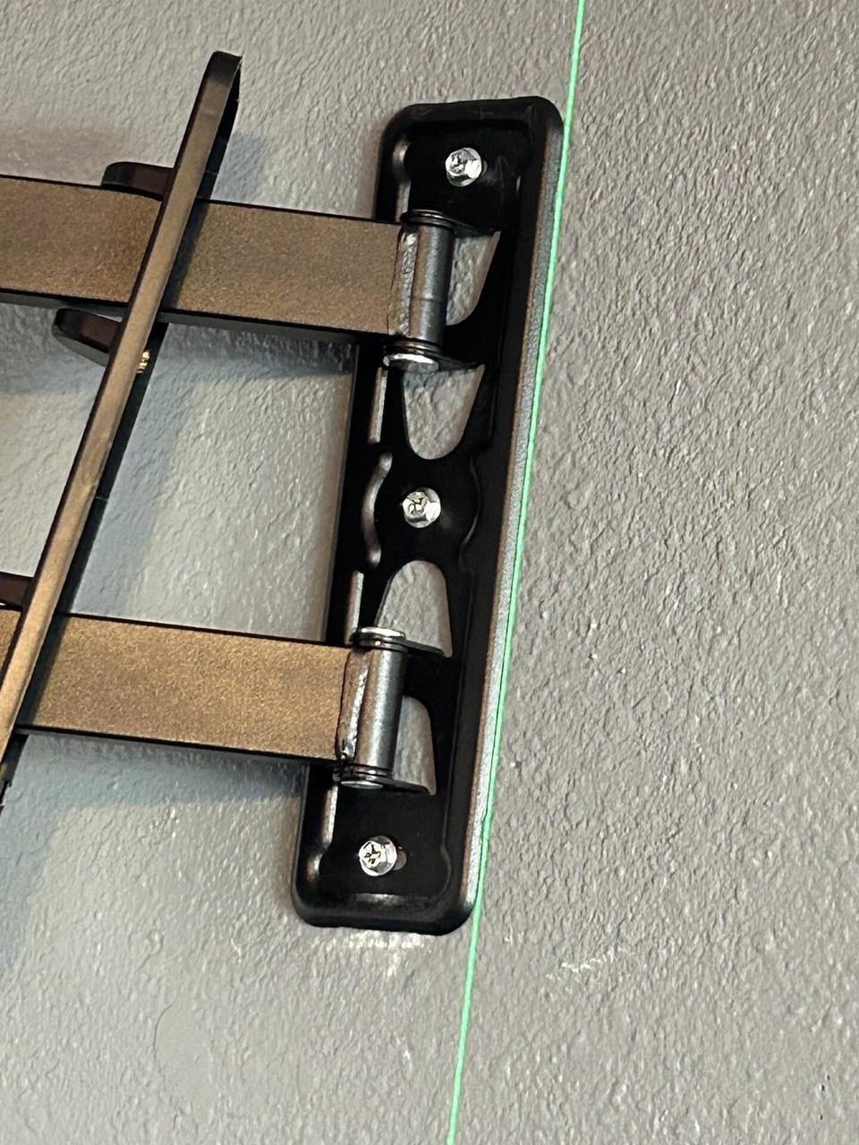 Alrty field photo with display bracket or mounting preparation onsite with wall hardware context
