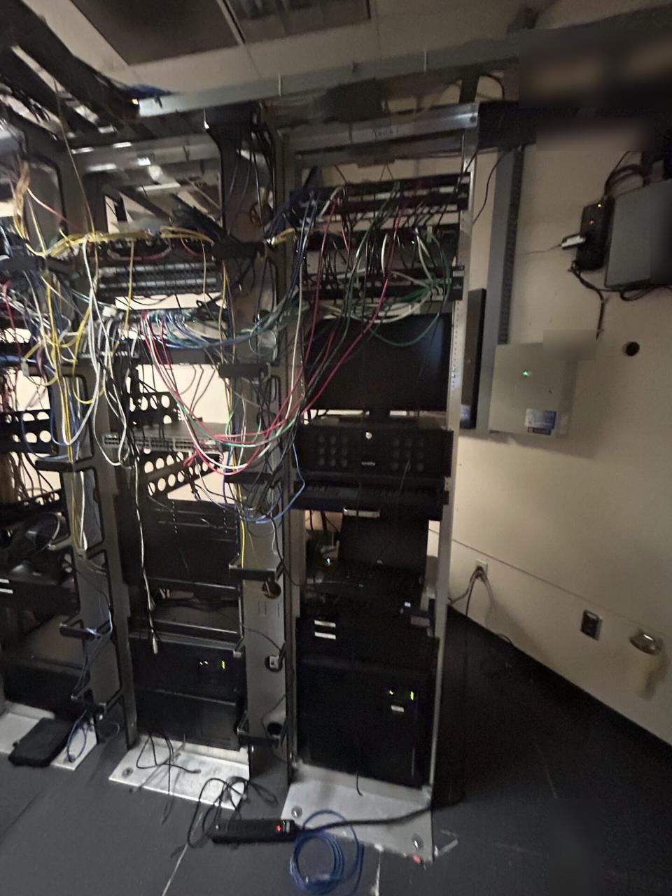 Alrty field photo with server-room teardown and network equipment inventory
