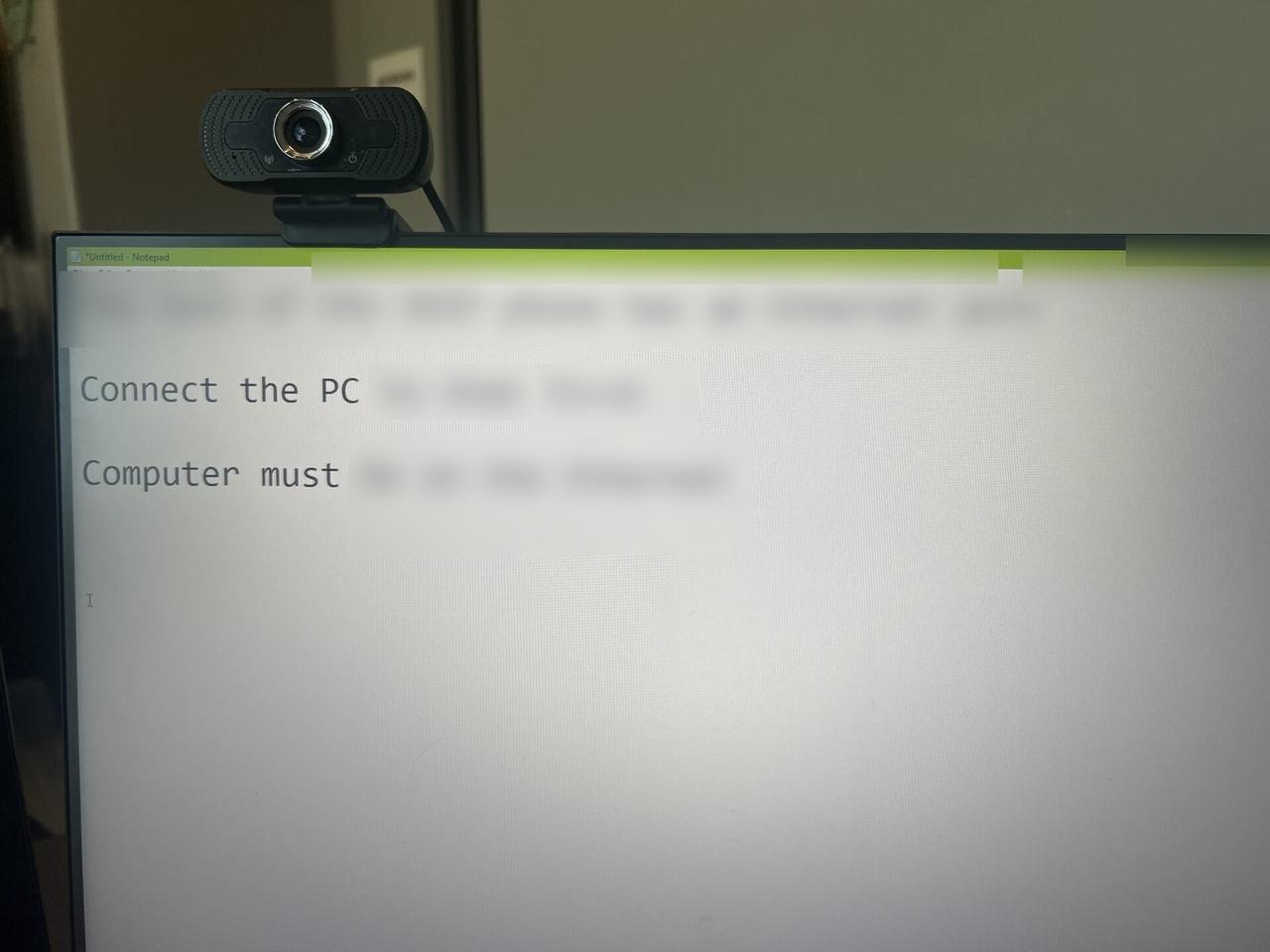 Onsite service photo showing desktop monitor during service verification at the service location