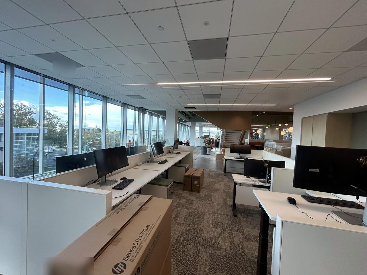 Office workstation setup with monitors before final user handoff documented for a smart technology service call
