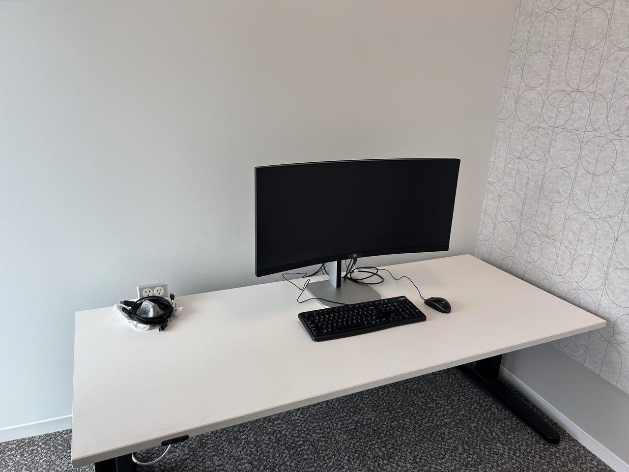 Office workstation setup with monitors during desk-side setup documented for a smart technology service call