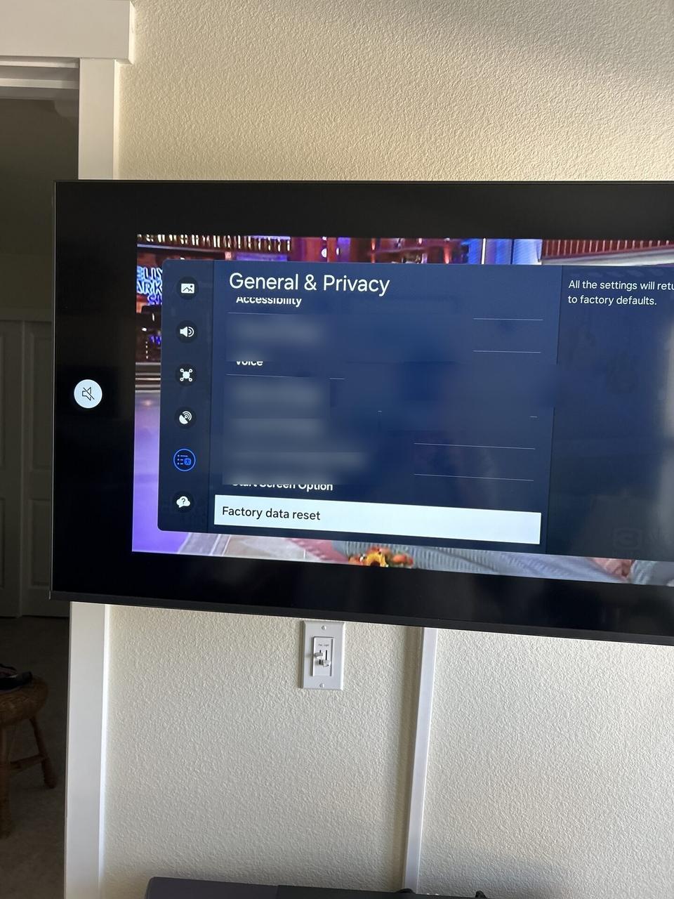 TV mounting or home theater setup detail with display placement, mount work, cabling or finished installation context